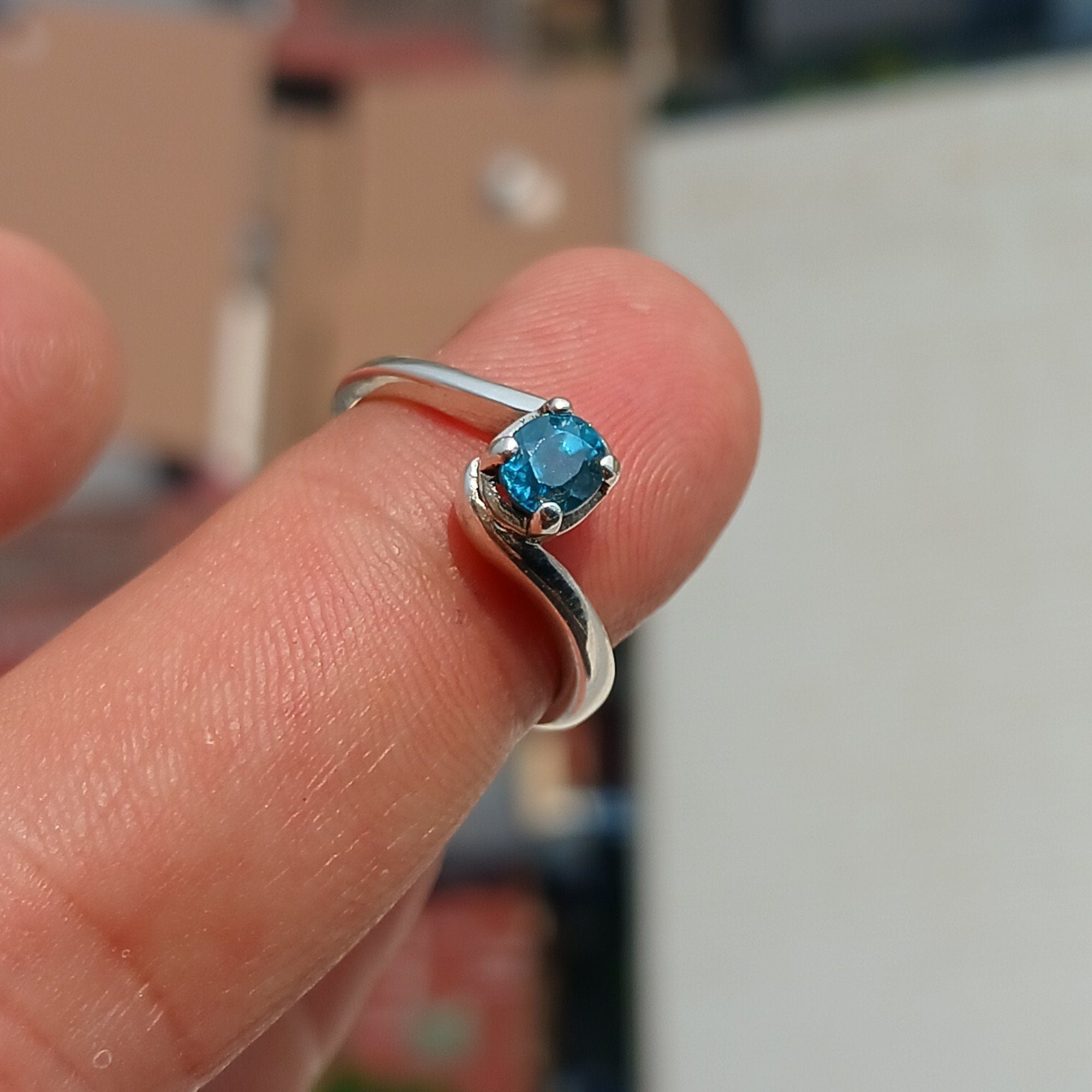 A beautiful Blue Zircon Ring set in polished 925 Sterling Silver, featuring an oval cut blue gemstone, perfect for elegant occasions.