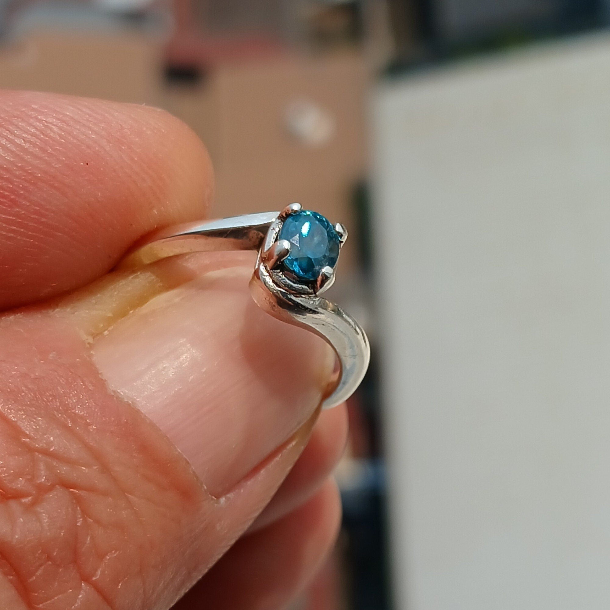A beautiful Blue Zircon Ring set in polished 925 Sterling Silver, featuring an oval cut blue gemstone, perfect for elegant occasions.