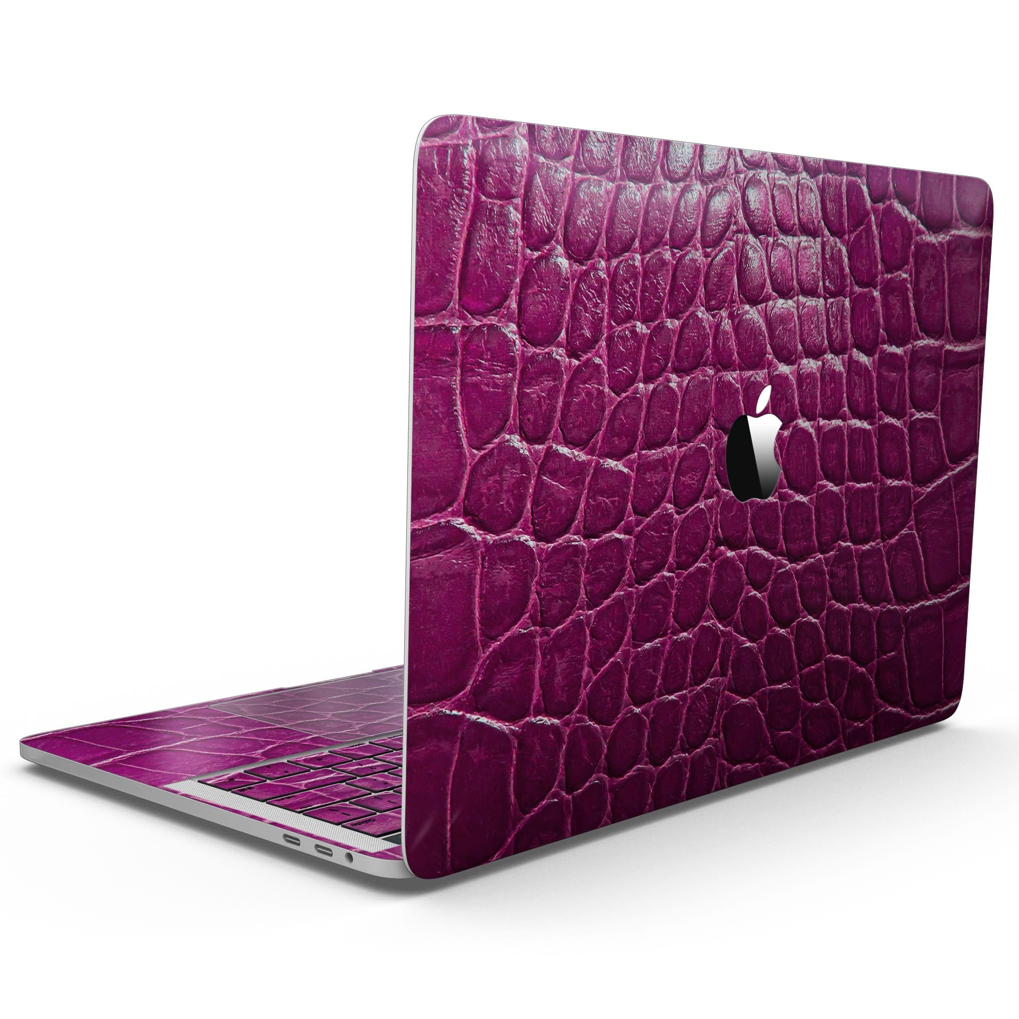 Bright magenta alligator skin MacBook Pro skin kit showcasing vibrant color and texture.