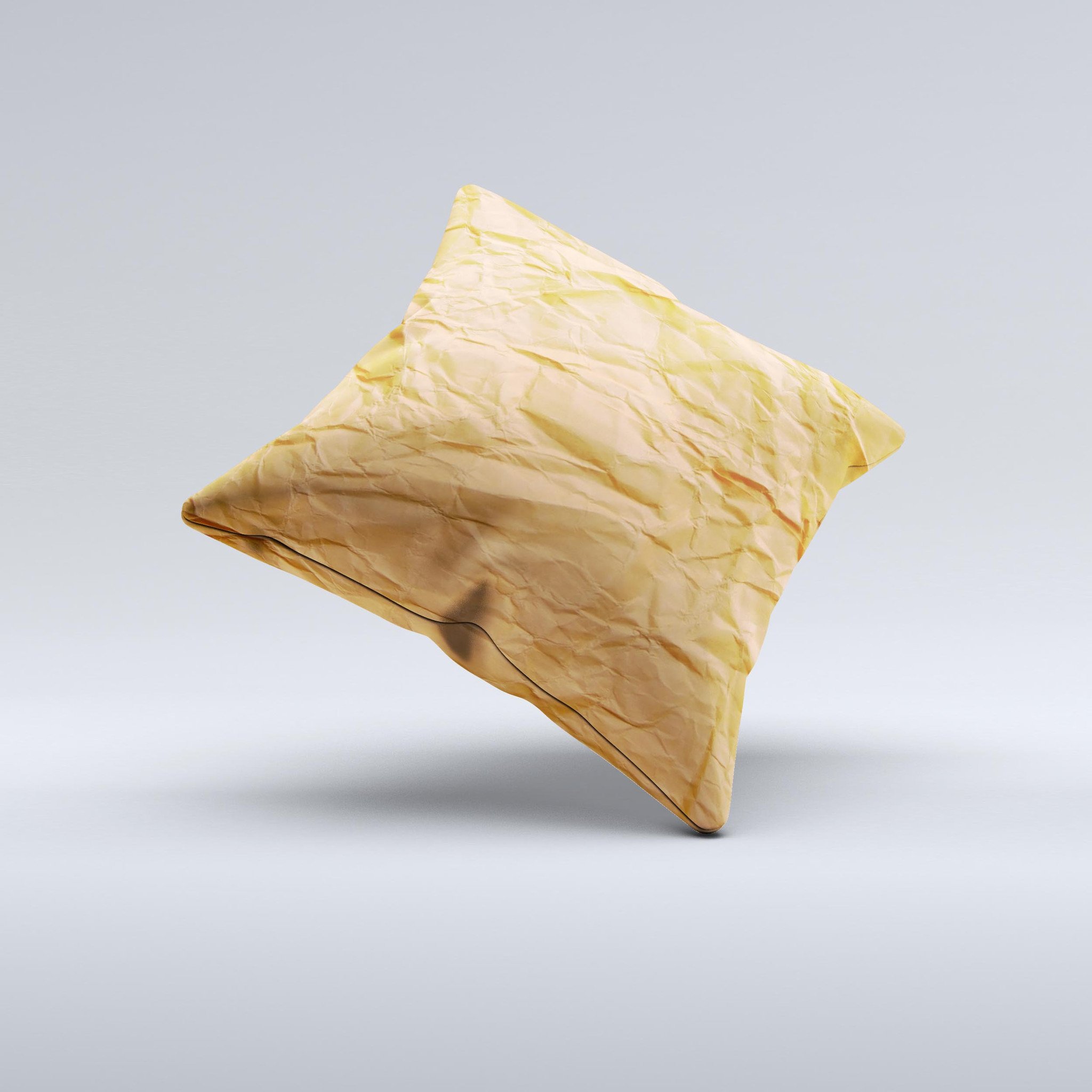 Brown crumpled paper ink-fuzed decorative throw pillow with unique handcrafted design, showcasing high-quality fabric and filling.