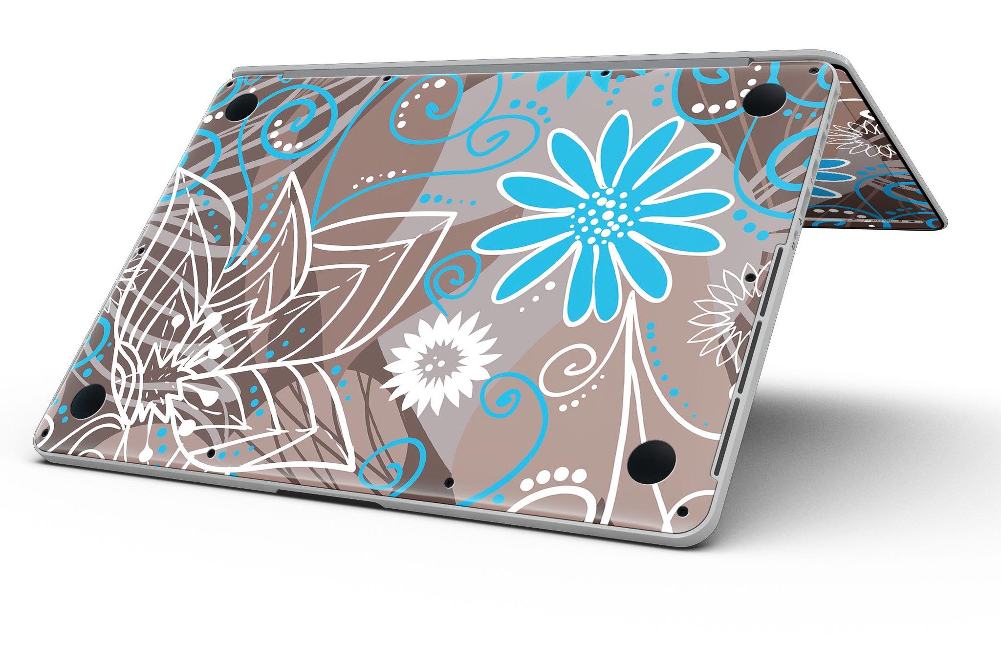 A MacBook Pro with a whimsical floral skin featuring a brown surface adorned with blue and white floral patterns, showcasing style and protection.