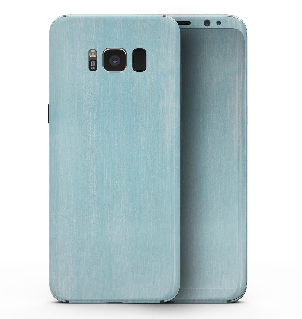 Brushed Aqua Surface skin kit for Samsung Galaxy S8, showcasing its vibrant color and texture on the device.