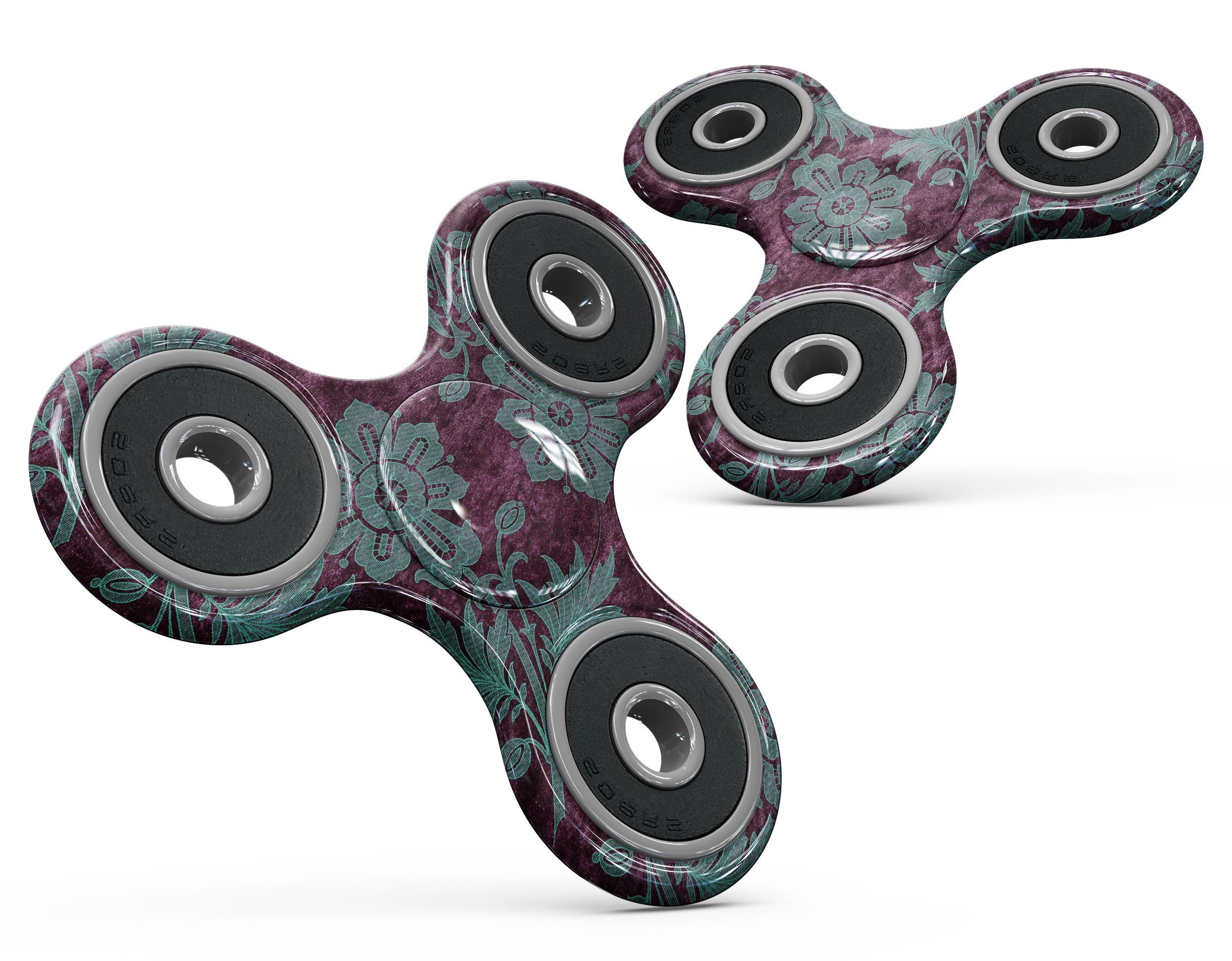 Burgundy and Turquoise Floral Velvet skin for fidget spinner, showcasing vibrant floral patterns on a sleek vinyl surface.