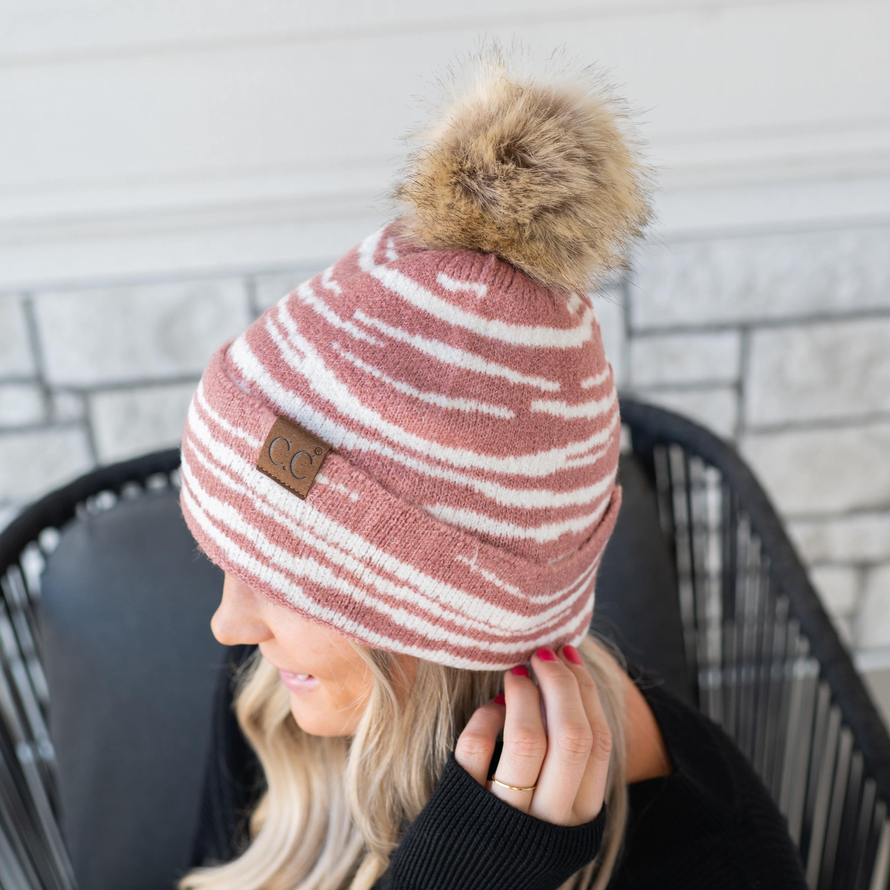 CC Beanie Animal Print Winter Hat featuring a stylish design with a faux fur pom, perfect for cold weather.