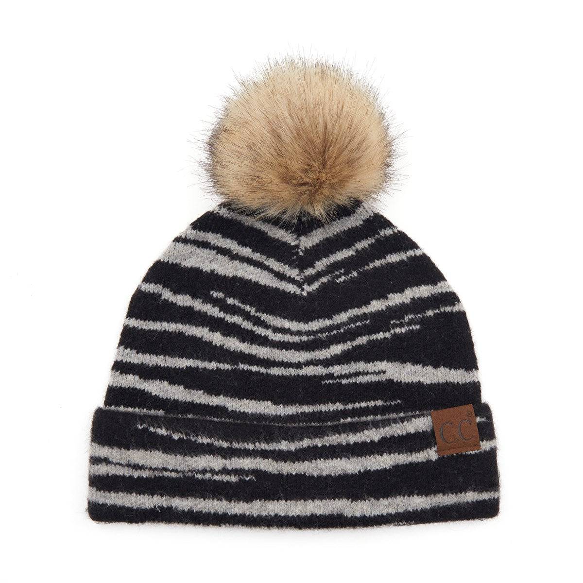 CC Beanie Animal Print Winter Hat featuring a stylish design with a faux fur pom, perfect for cold weather.