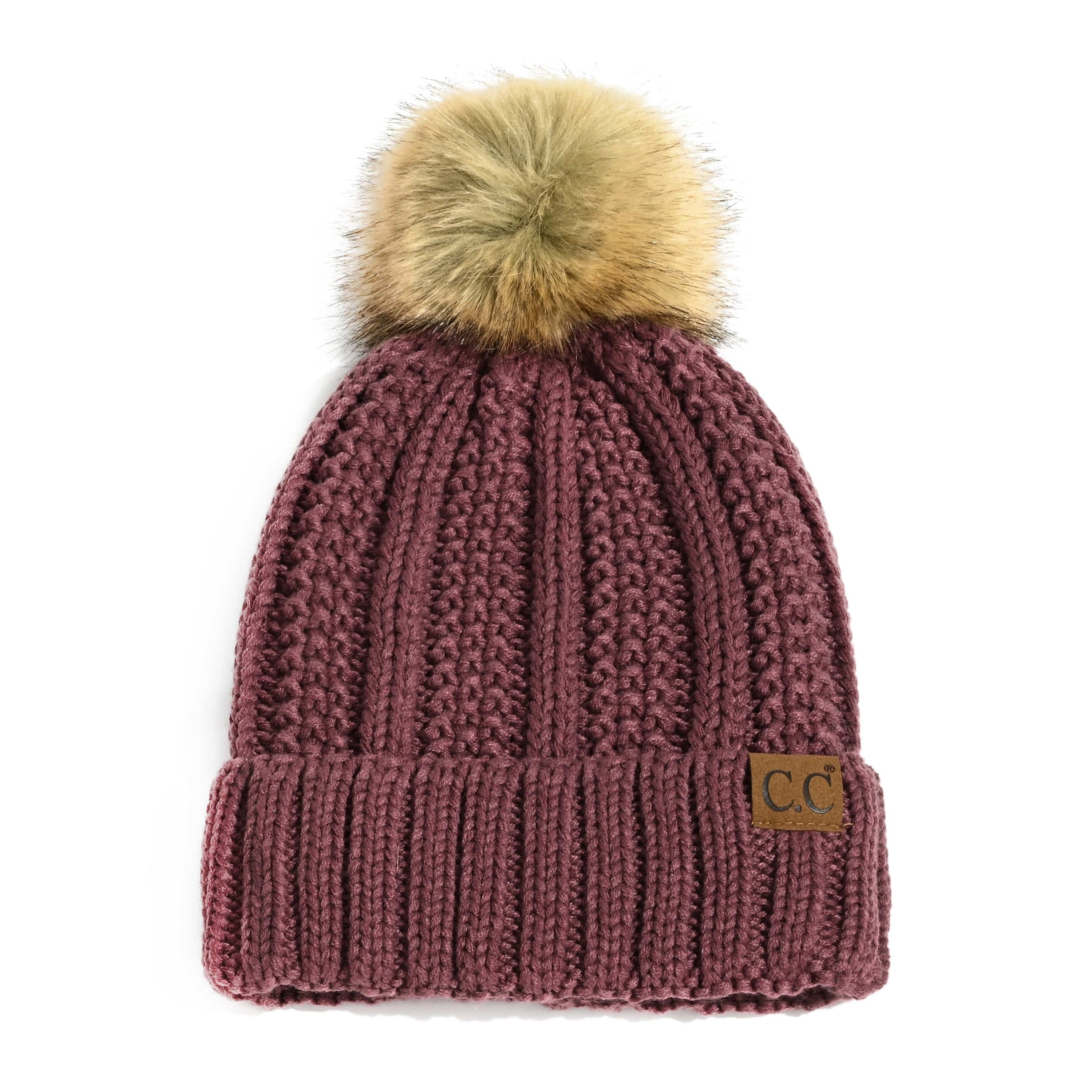 CC Bold Pom Accented Beanie with faux fur pom, cozy fleece lining, and authentic C.C.® branding, suitable for kids and adults.