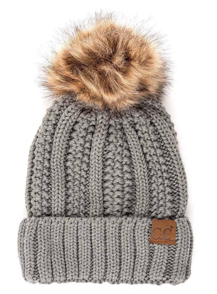 CC Bold Pom Accented Beanie with faux fur pom, cozy fleece lining, and authentic C.C.® branding, suitable for kids and adults.
