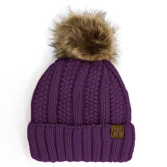 CC Bold Pom Accented Beanie with faux fur pom, cozy fleece lining, and authentic C.C.® branding, suitable for kids and adults.