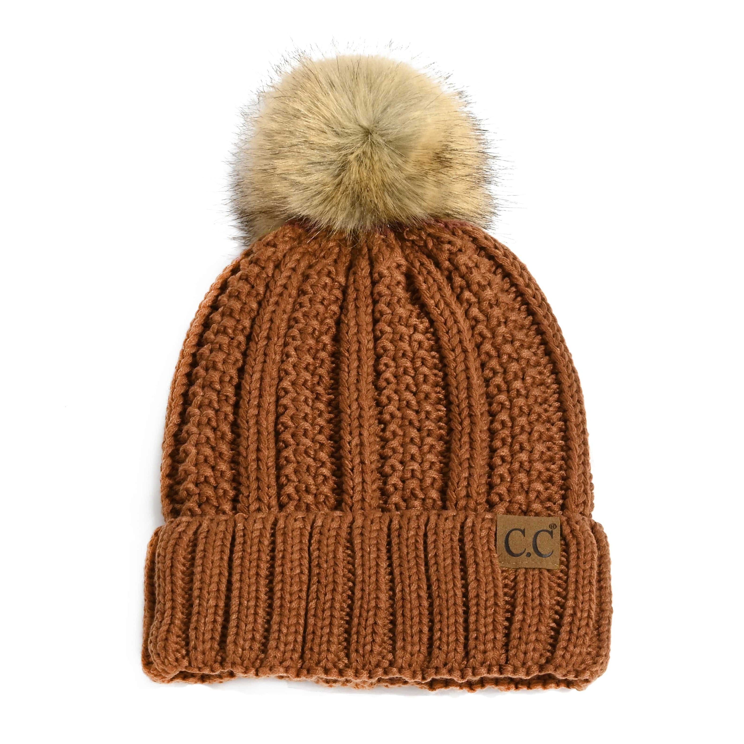CC Bold Pom Accented Beanie with faux fur pom, cozy fleece lining, and authentic C.C.® branding, suitable for kids and adults.