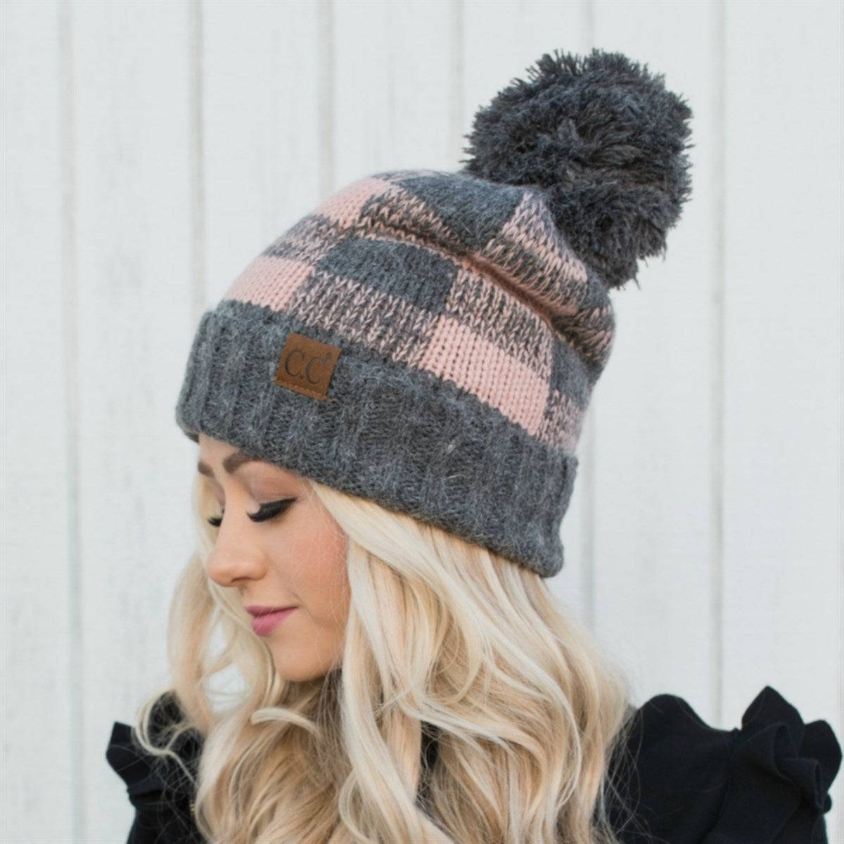 CC Buffalo Plaid Beanie with faux fur pom, fleece lined, showcasing a trendy buffalo check pattern.