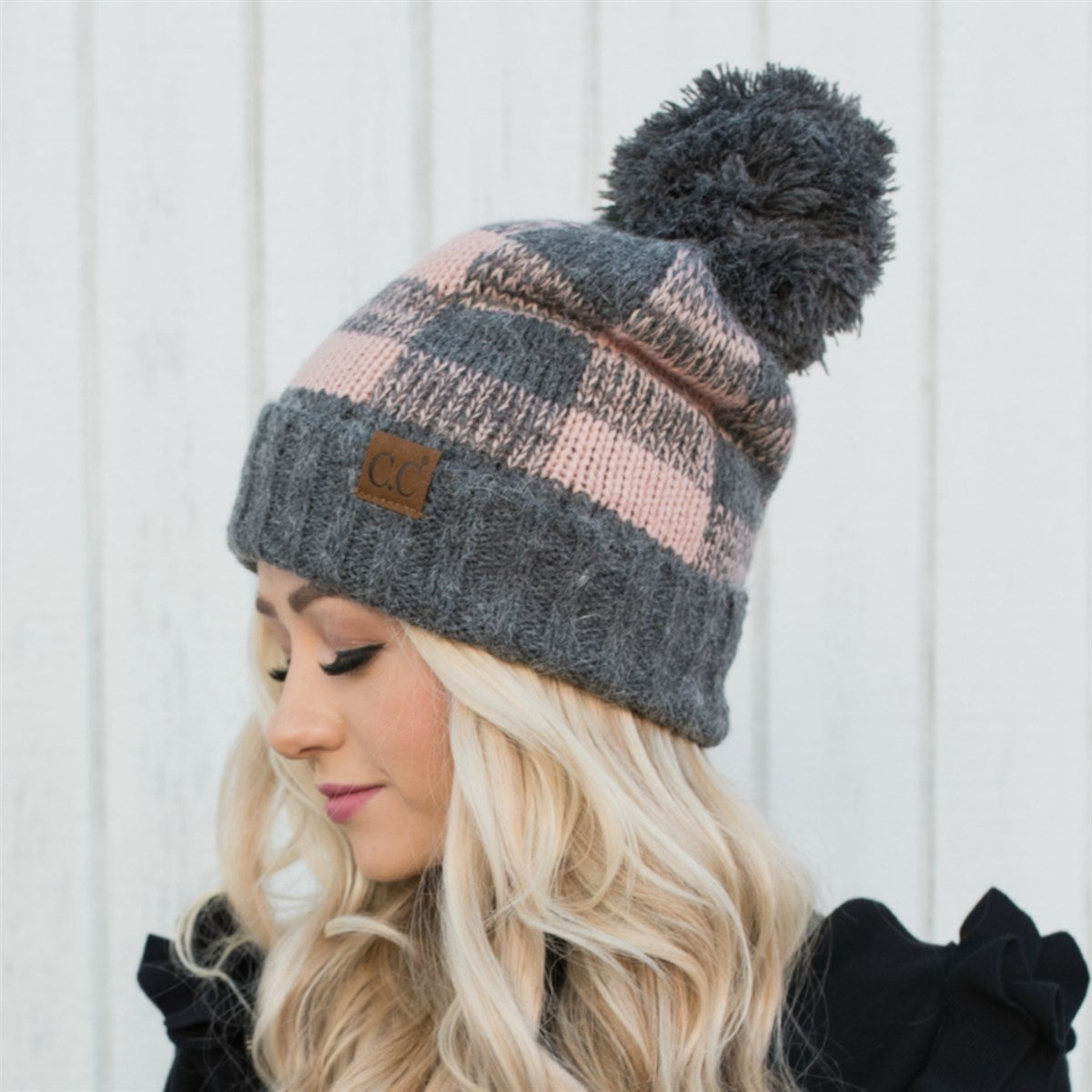 CC Buffalo Plaid Beanie with faux fur pom, fleece lined, showcasing a trendy buffalo check pattern.