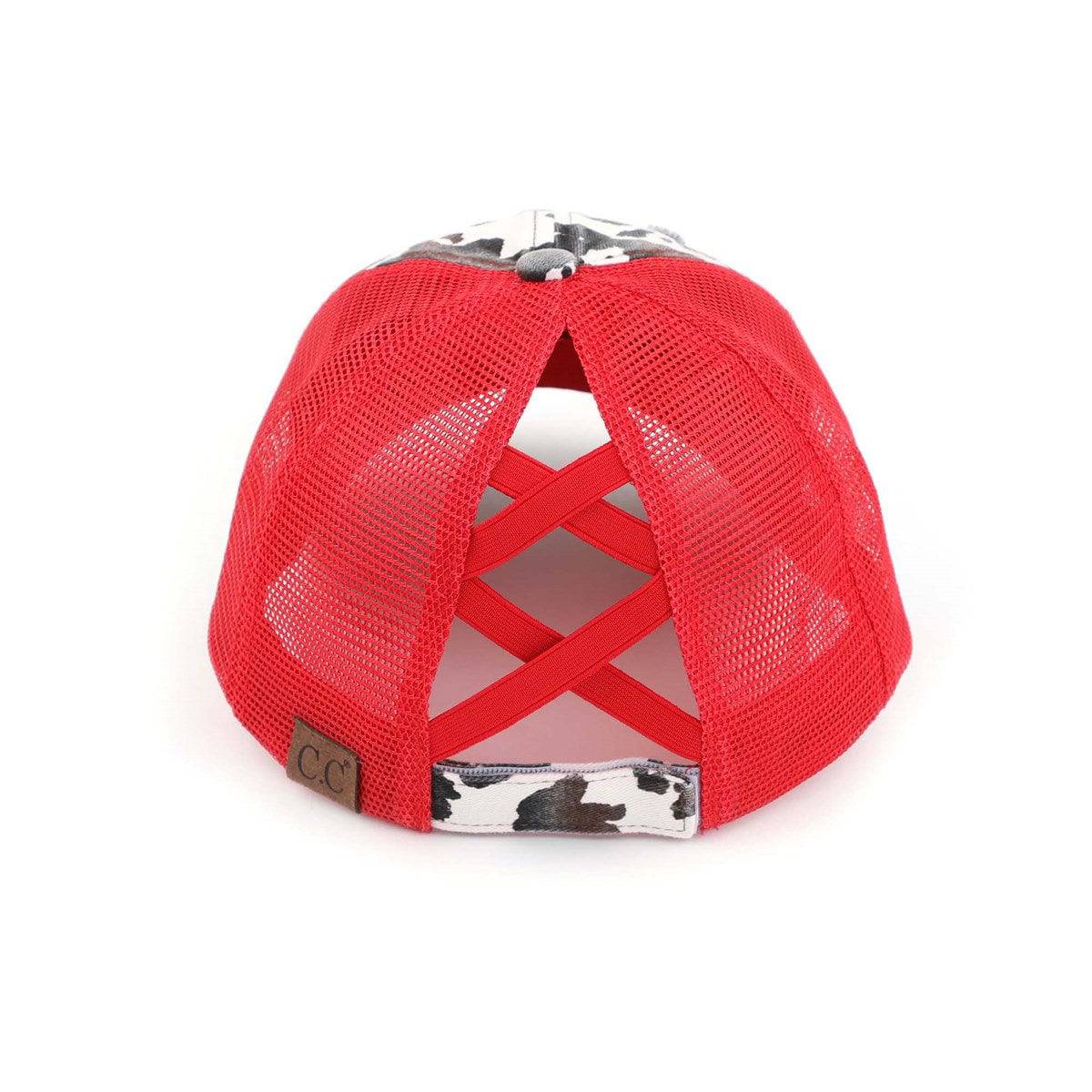 CC Cow Print Pony Hat featuring criss-cross elastic for ponytails, soft cotton material, and adjustable velcro strap.