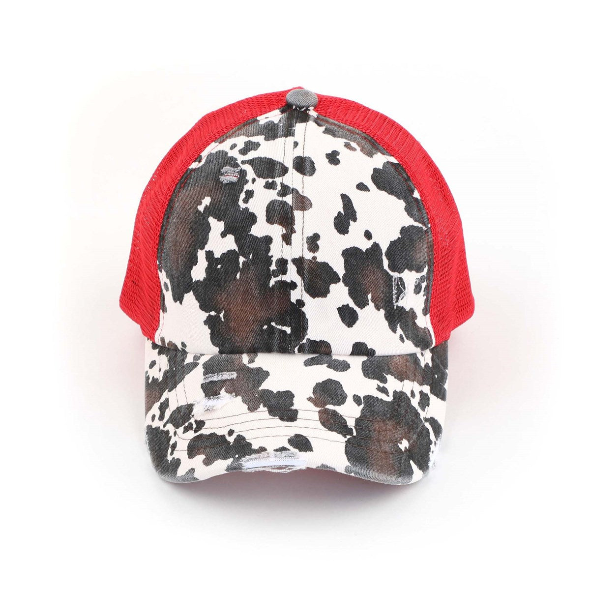 CC Cow Print Pony Hat featuring criss-cross elastic for ponytails, soft cotton material, and adjustable velcro strap.