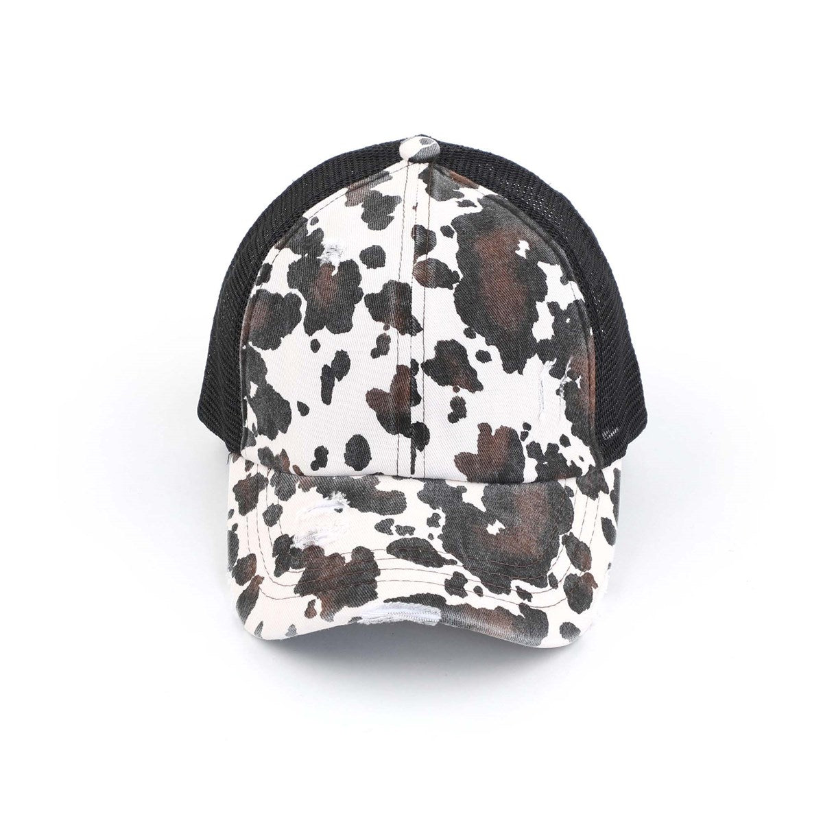CC Cow Print Pony Hat featuring criss-cross elastic for ponytails, soft cotton material, and adjustable velcro strap.