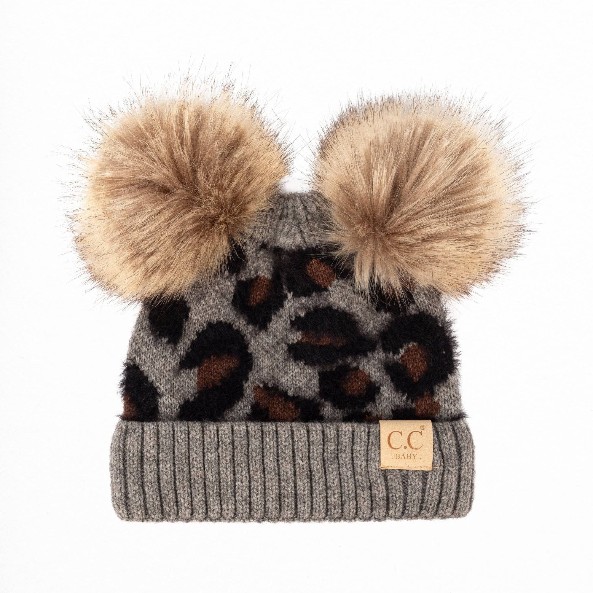 CC Double Pom Baby & Kids Leopard Beanie with fluffy faux fur poms and stylish leopard print design, perfect for keeping kids warm.