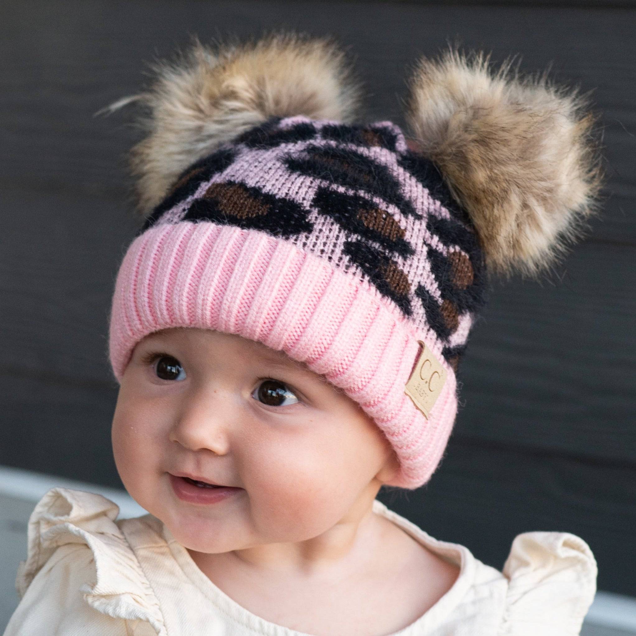 CC Double Pom Baby & Kids Leopard Beanie with fluffy faux fur poms and stylish leopard print design, perfect for keeping kids warm.