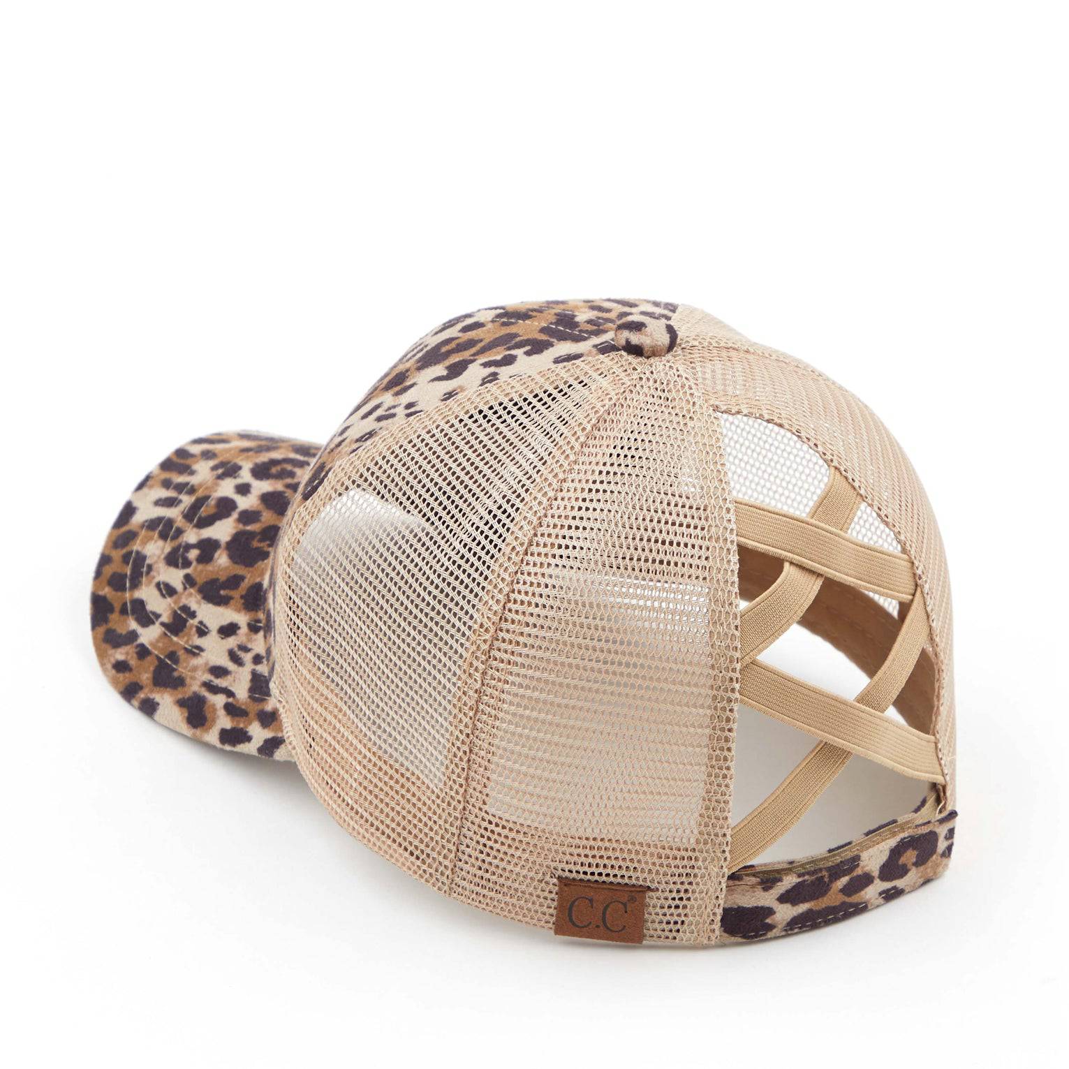 CC Faux Suede Leopard Hat featuring criss-cross and ponytail openings, showcasing its stylish leopard pattern and adjustable strap.
