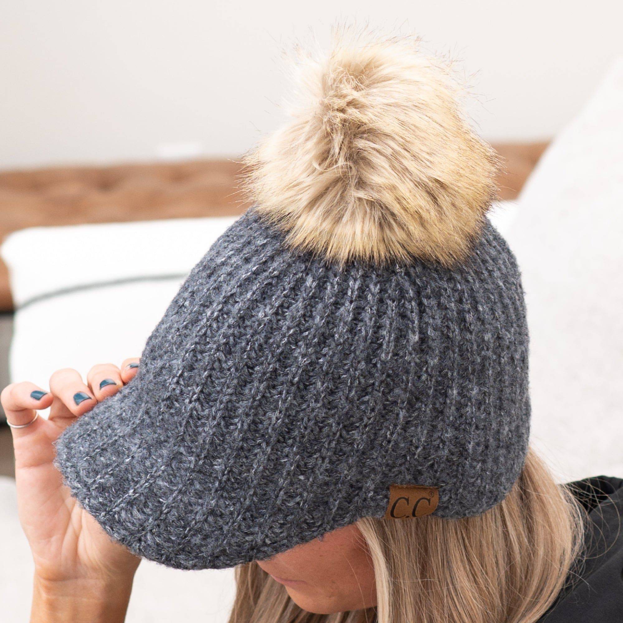 CC Kid and Adult Sizes Winter Knitted Ball Cap Beanie with faux fur pom, showcasing its cable knit design and brim feature.