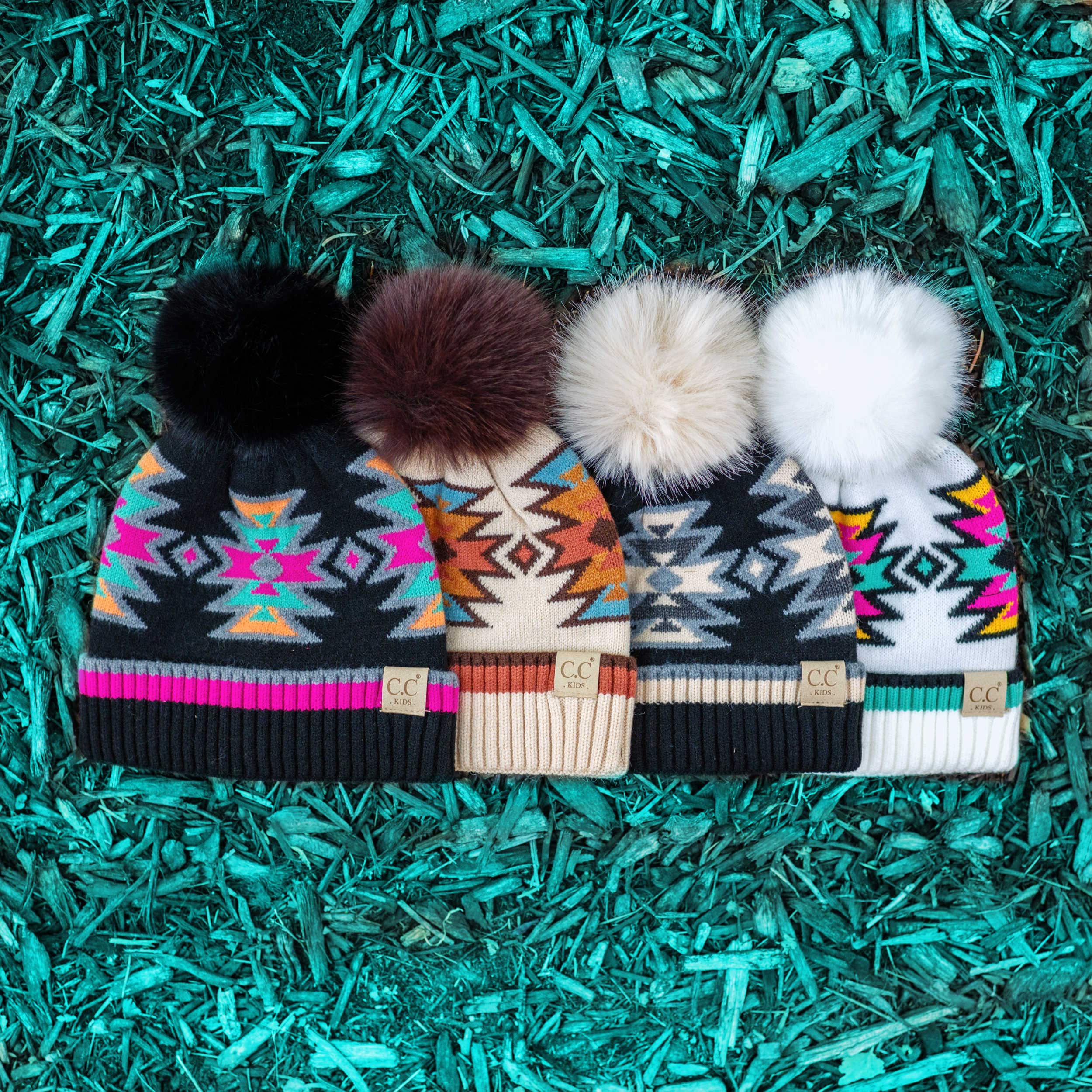 CC Kids South Western Pattern Faux Fur Pom Beanie featuring a vibrant design and a fluffy 4.5-inch faux fur pom.
