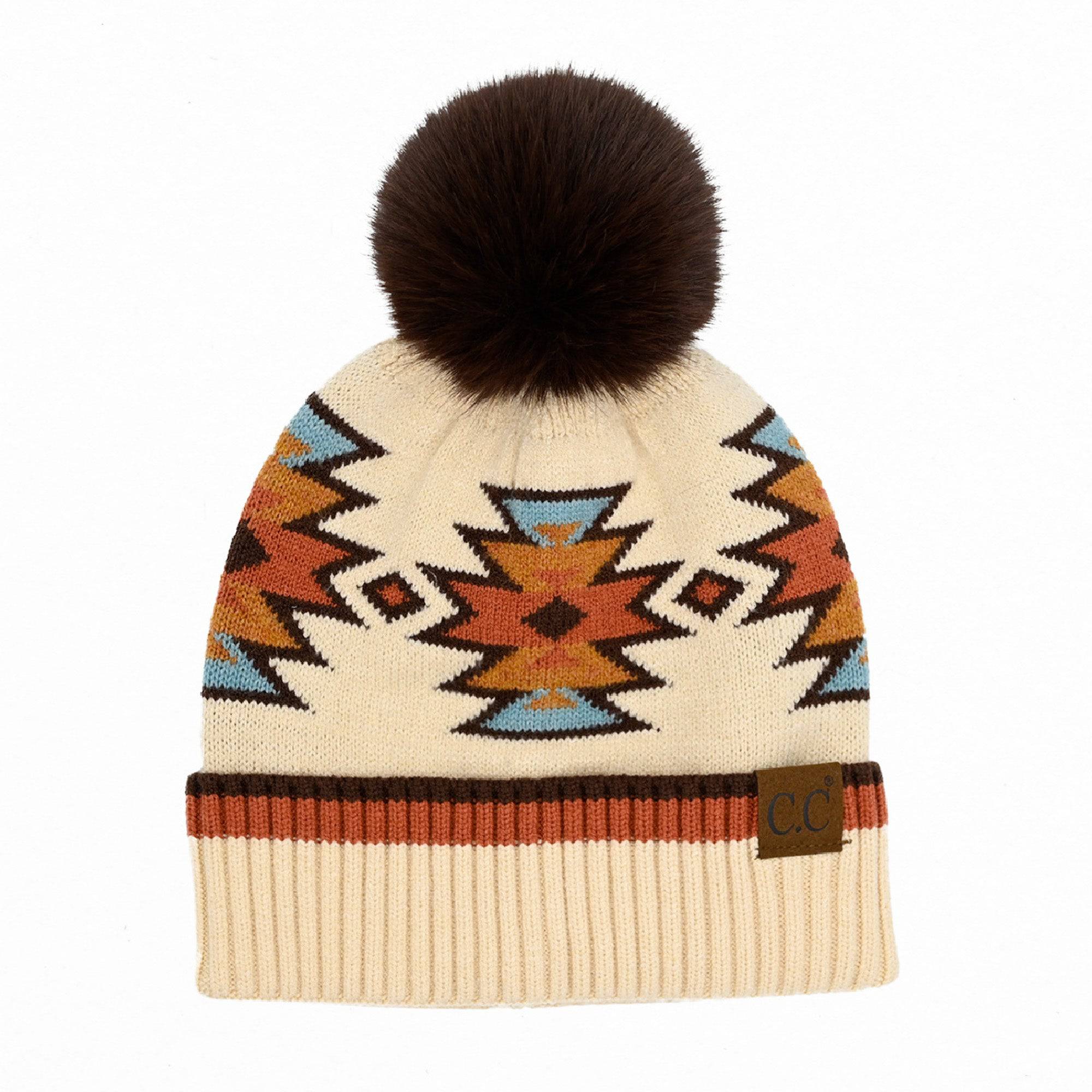 CC Kids South Western Pattern Faux Fur Pom Beanie featuring a vibrant design and a fluffy 4.5-inch faux fur pom.