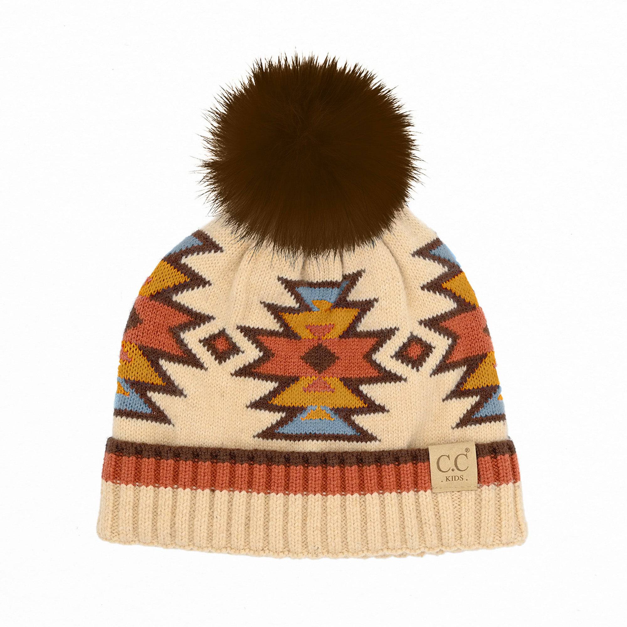 CC Kids South Western Pattern Faux Fur Pom Beanie featuring a vibrant design and a fluffy 4.5-inch faux fur pom.