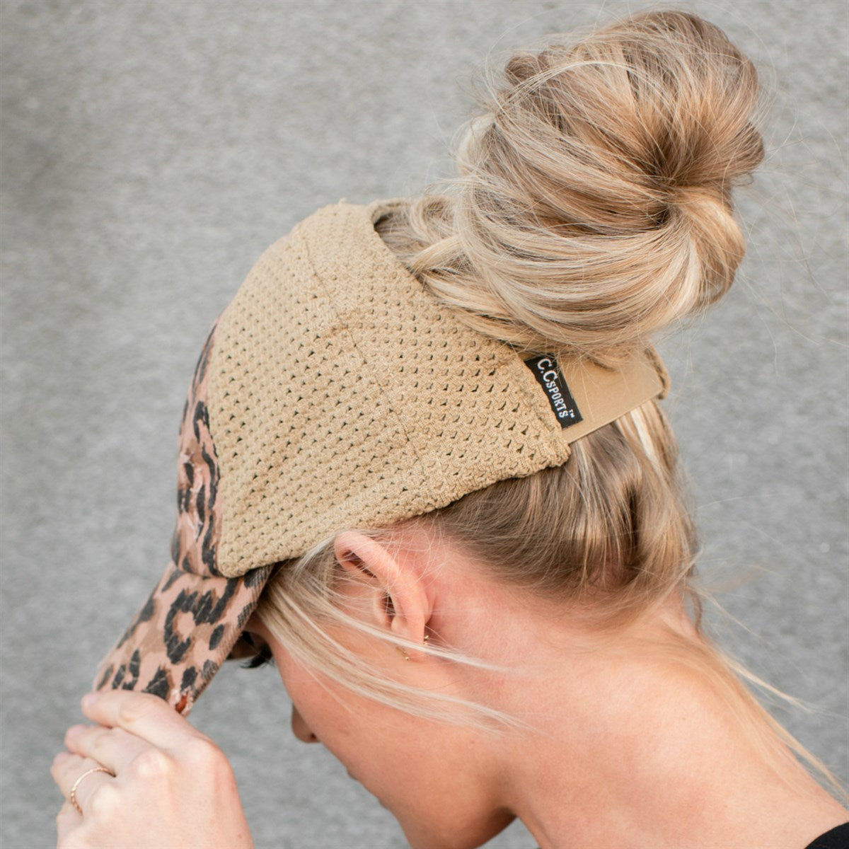 CC Leopard Women Hat featuring a stretchy leopard print design, perfect for ponytails and messy buns, showcasing a comfortable glove-like fit.