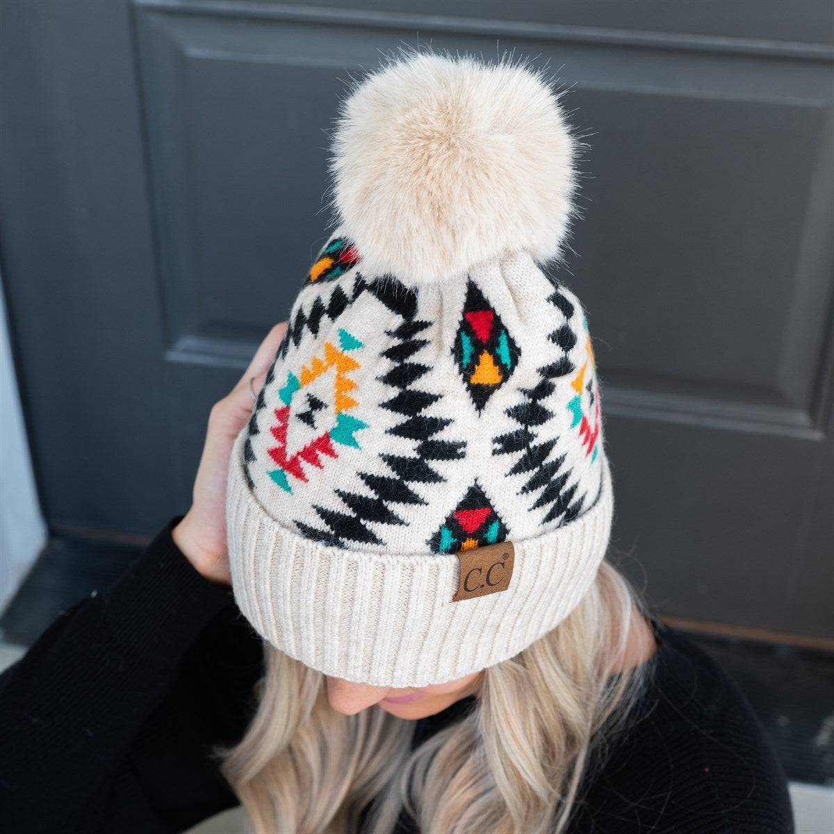 CC South Western Print Beanie with faux fur pom and Aztec pattern, perfect for winter fashion.