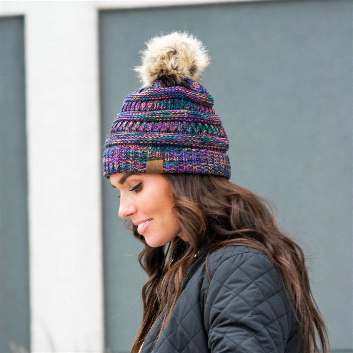 CC Trending 4-Tone Beanie with Tan Pom Pom, showcasing stylish multi-color yarn and fluffy faux fur pom.