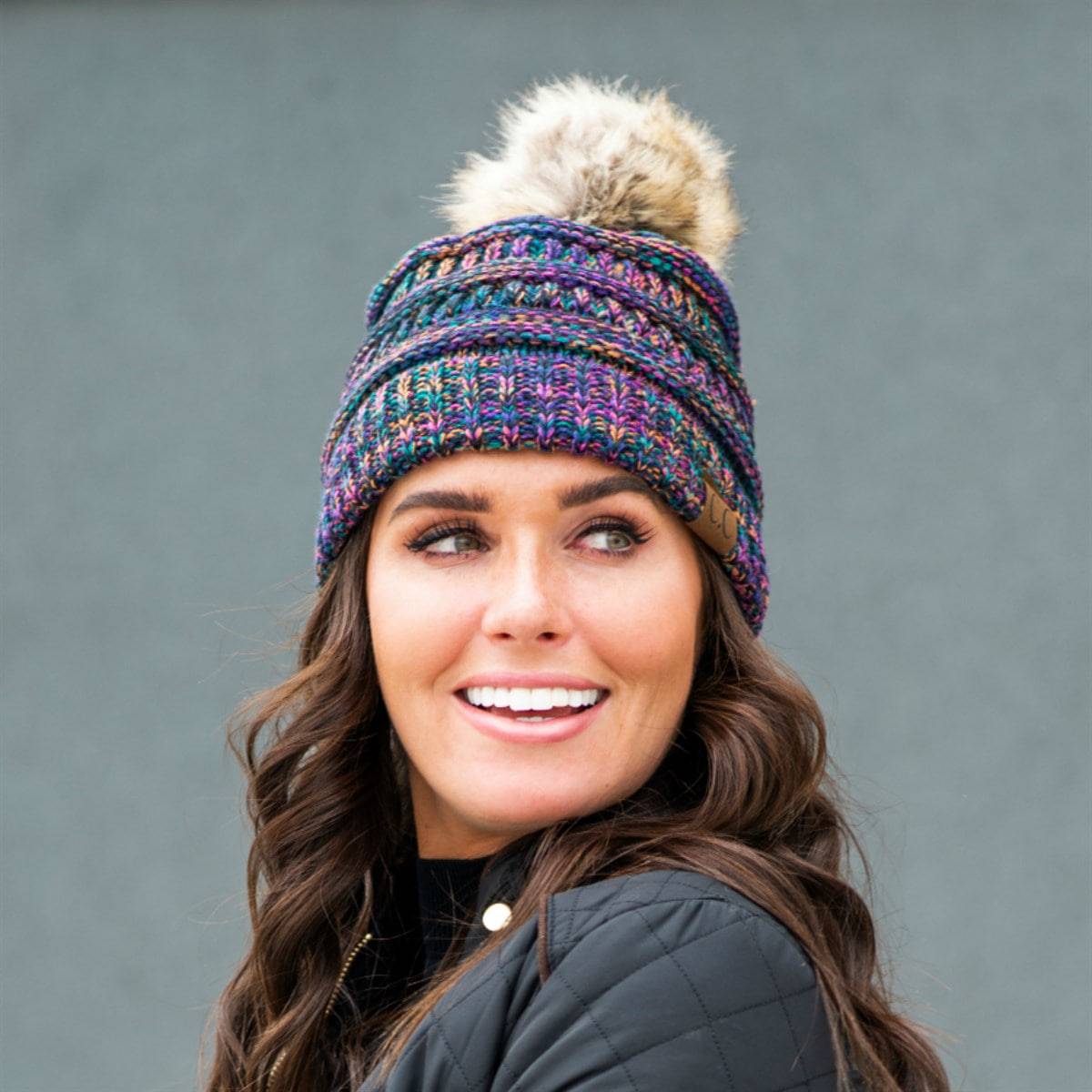 CC Trending 4-Tone Beanie with Tan Pom Pom, showcasing stylish multi-color yarn and fluffy faux fur pom.
