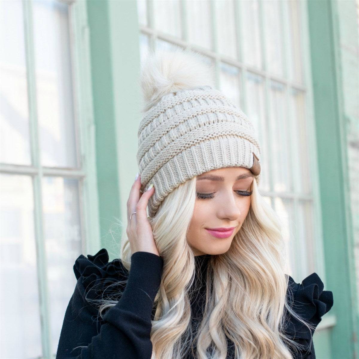 CC Trending Pom Beanie in school spirit colors with a cozy cable knit texture and matching faux fur pom.
