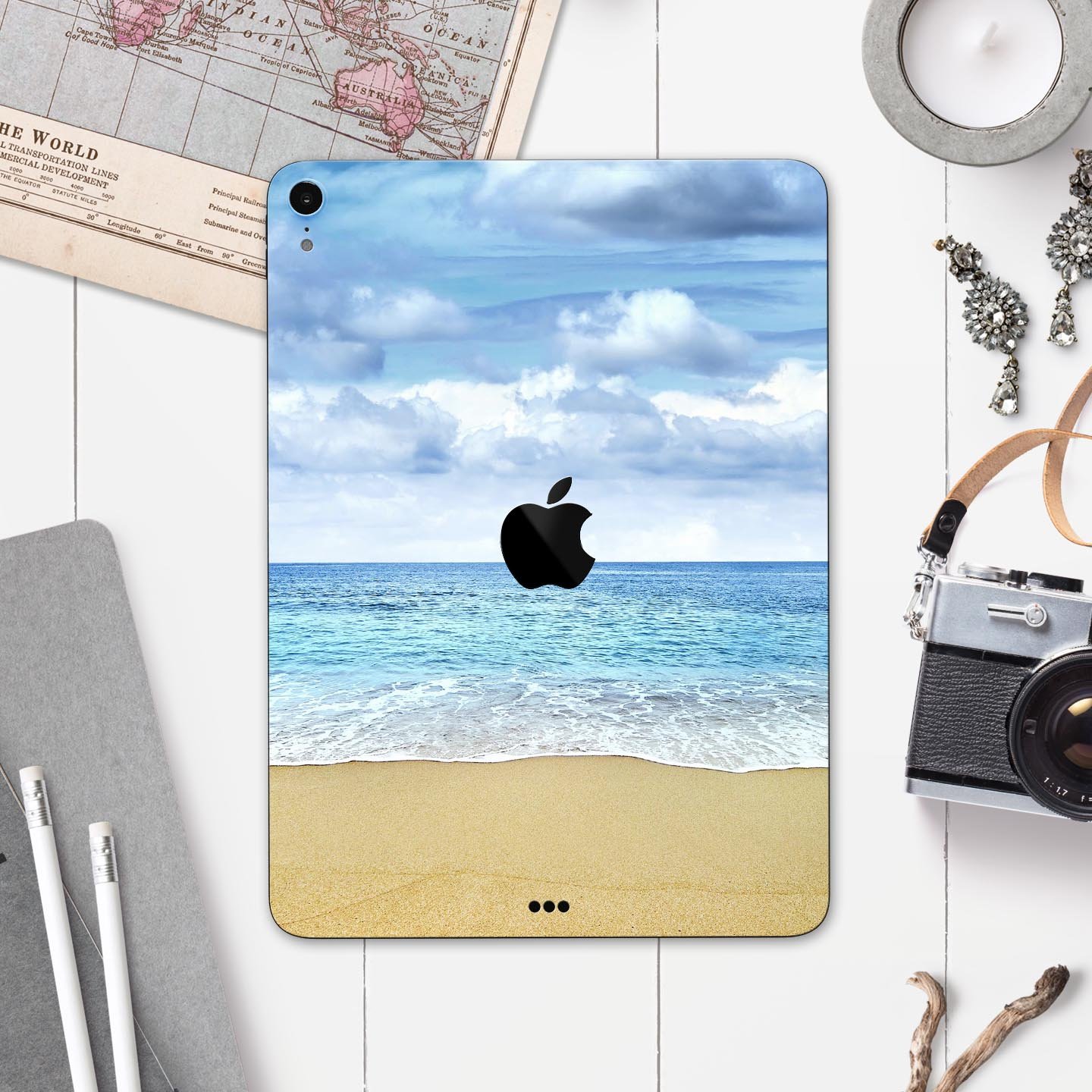 Calm Blue Sky and Sea Shore skin decal for Apple iPad, showcasing a serene beach scene with vibrant colors and a sleek design.