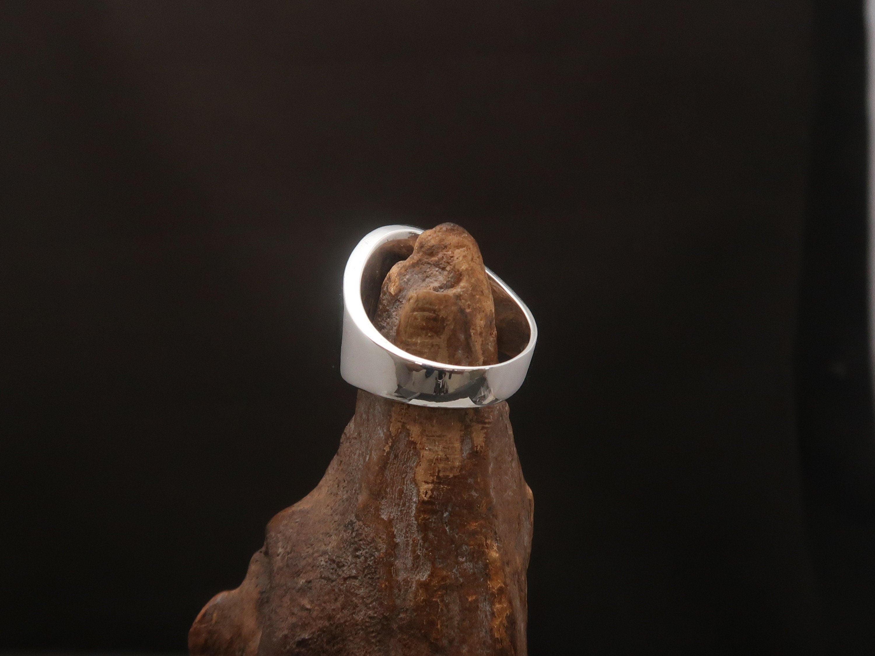 A stylish Canadian Flag Ring featuring the iconic Maple Leaf design, crafted from high-quality Sterling Silver with a mirror polished finish.