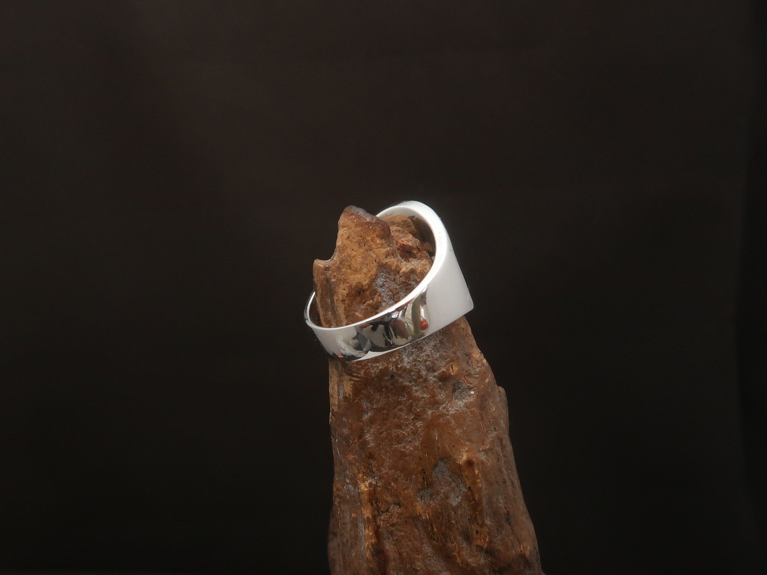 A stylish Canadian Flag Ring featuring the iconic Maple Leaf design, crafted from high-quality Sterling Silver with a mirror polished finish.