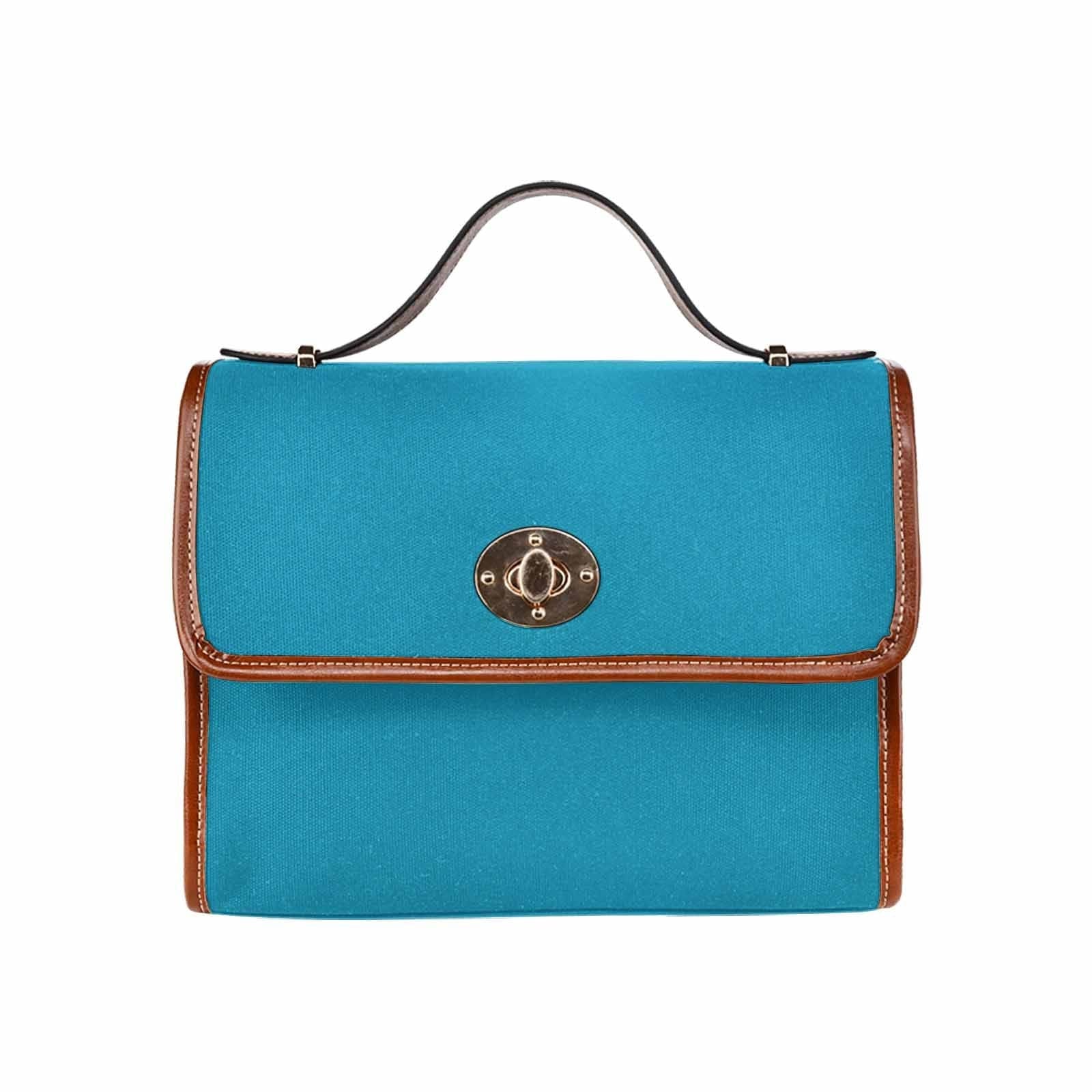 Stylish blue-green canvas handbag with brown crossbody strap, showcasing its waterproof design and spacious interior.