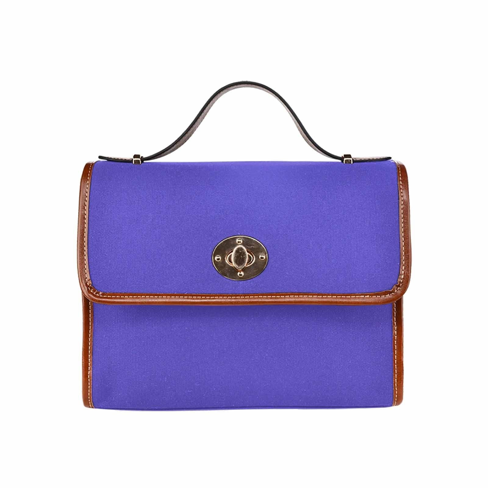 Blue Iris Waterproof Canvas Handbag with brown crossbody strap, showcasing its stylish design and durable material.