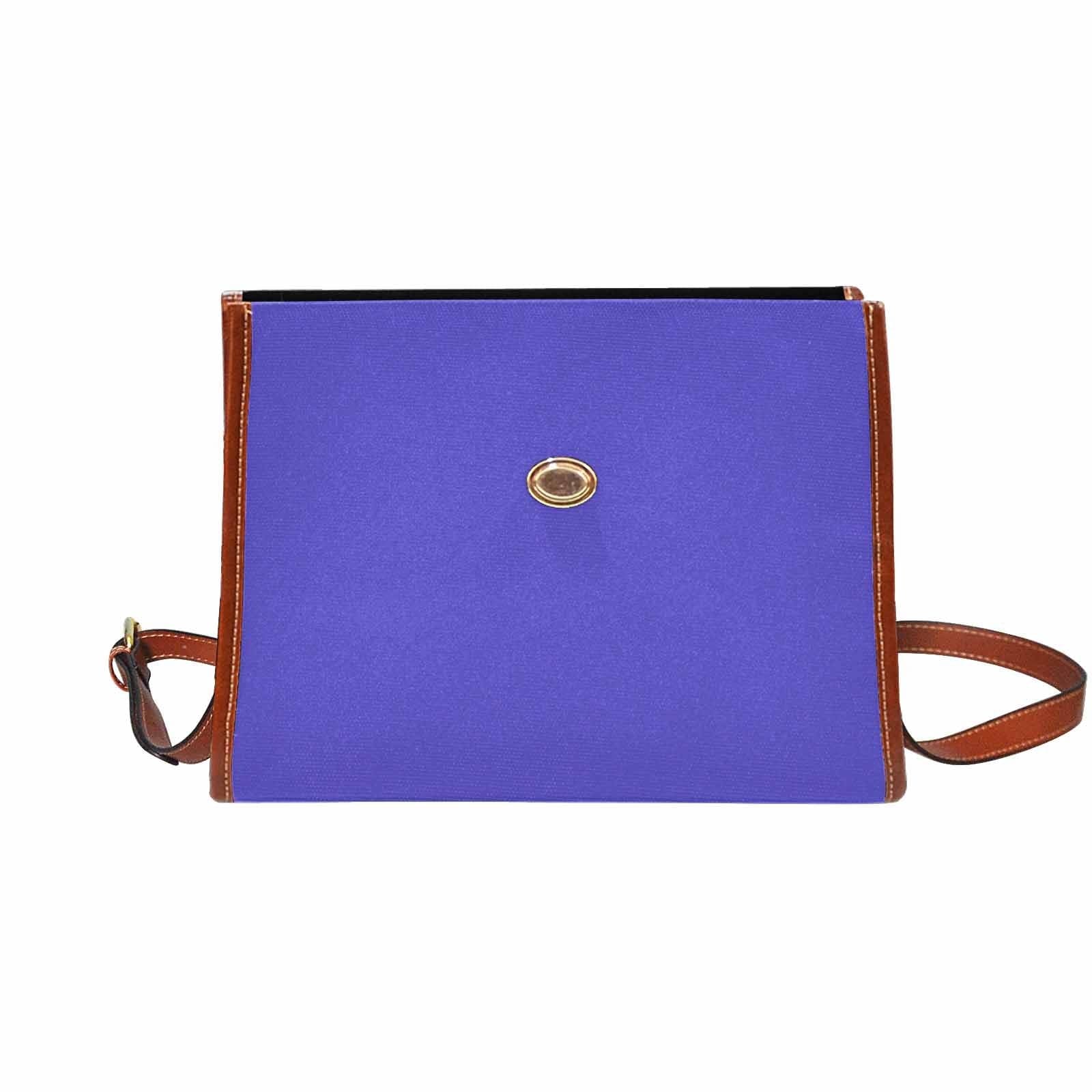 Blue Iris Waterproof Canvas Handbag with brown crossbody strap, showcasing its stylish design and durable material.
