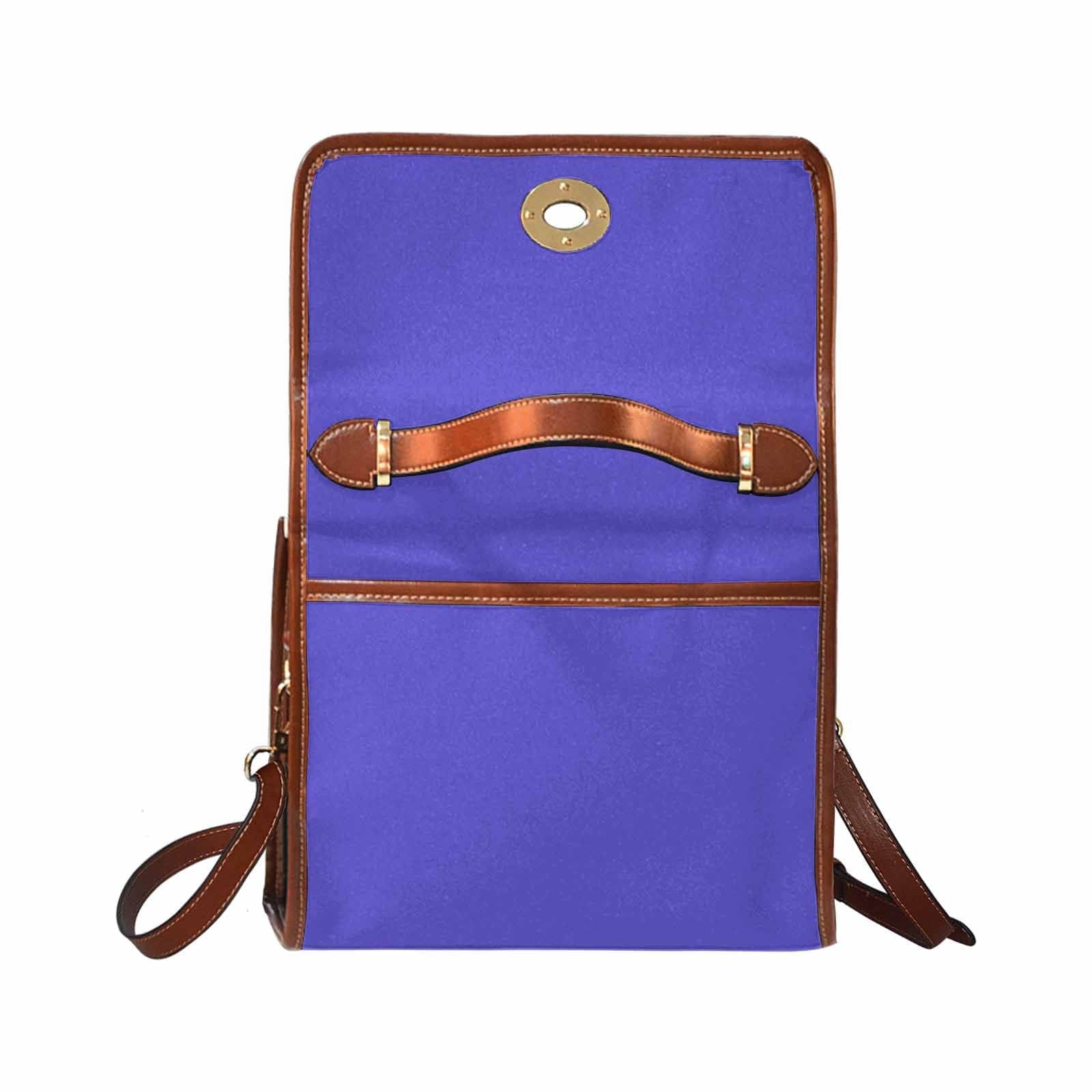 Blue Iris Waterproof Canvas Handbag with brown crossbody strap, showcasing its stylish design and durable material.