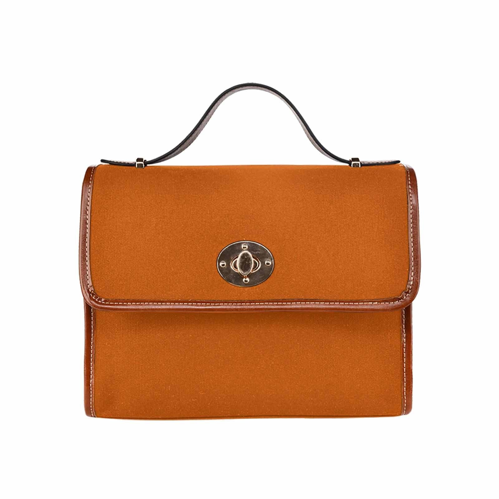 Stylish burnt orange brown canvas handbag with adjustable strap and multiple pockets, perfect for everyday use.