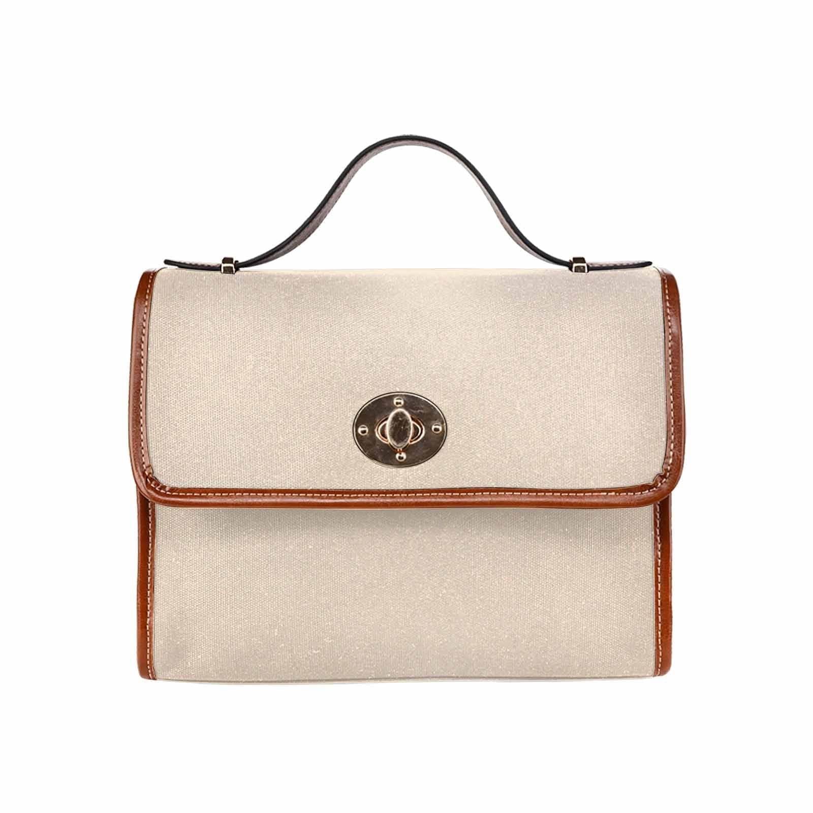 Stylish champagne beige canvas handbag with brown crossbody strap, featuring two interior pockets and a zipper pocket.