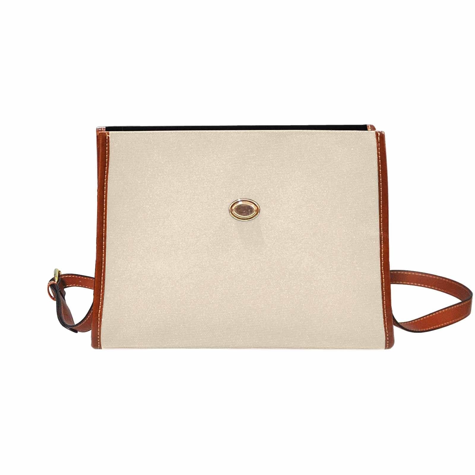 Stylish champagne beige canvas handbag with brown crossbody strap, featuring two interior pockets and a zipper pocket.
