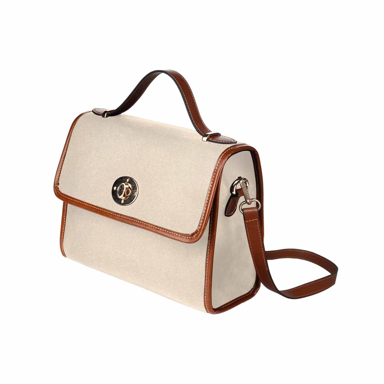 Stylish champagne beige canvas handbag with brown crossbody strap, featuring two interior pockets and a zipper pocket.