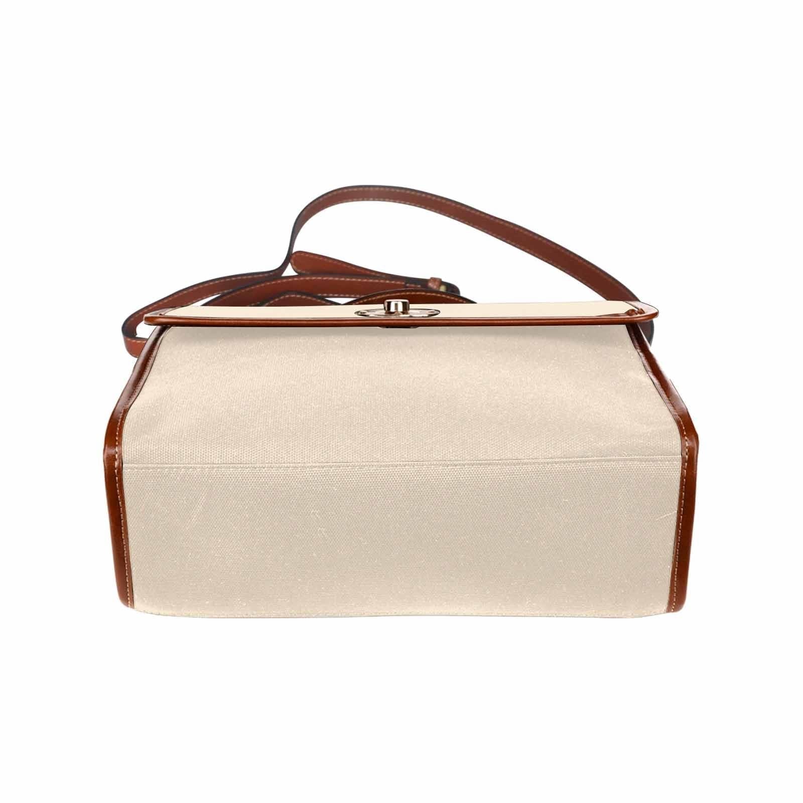 Stylish champagne beige canvas handbag with brown crossbody strap, featuring two interior pockets and a zipper pocket.