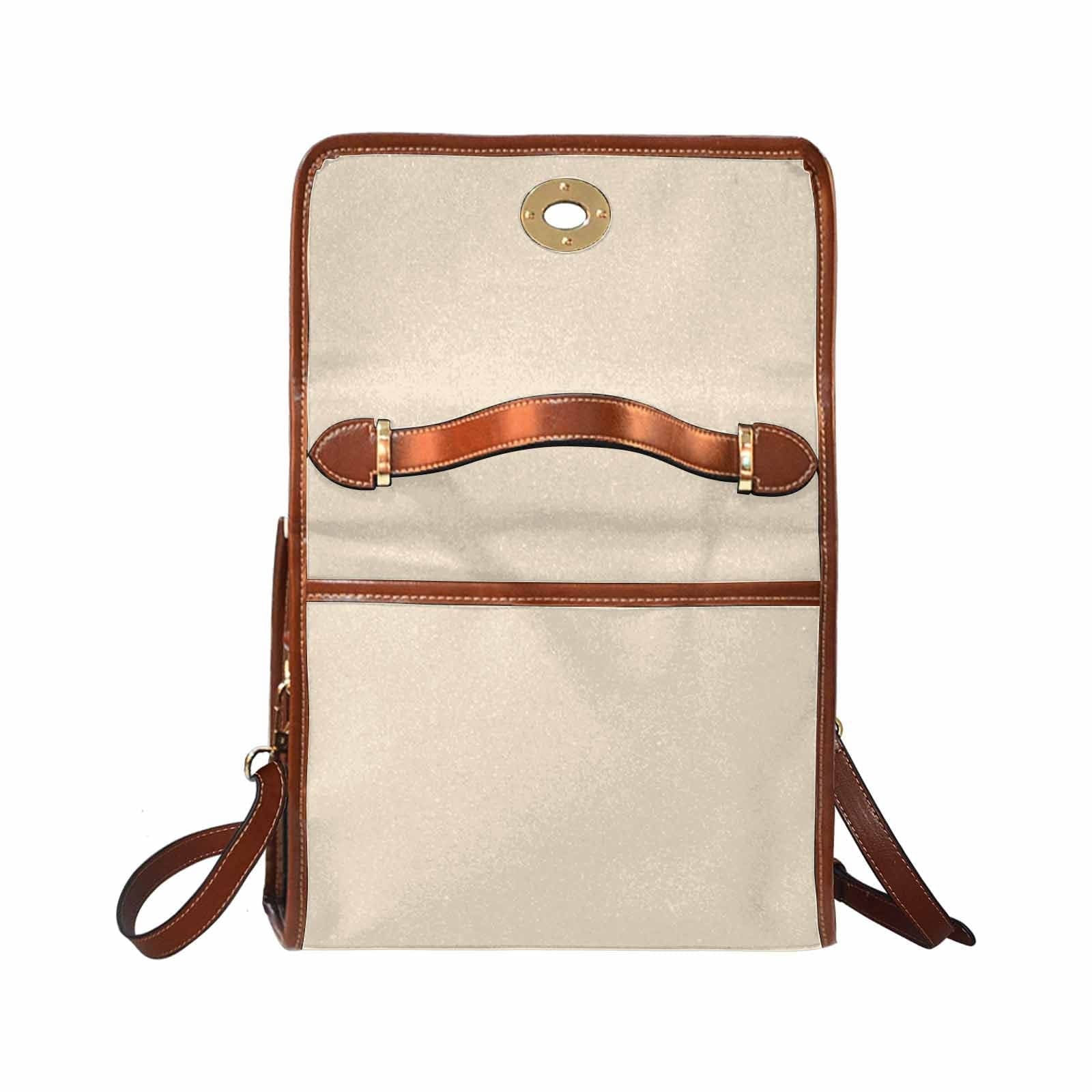 Stylish champagne beige canvas handbag with brown crossbody strap, featuring two interior pockets and a zipper pocket.