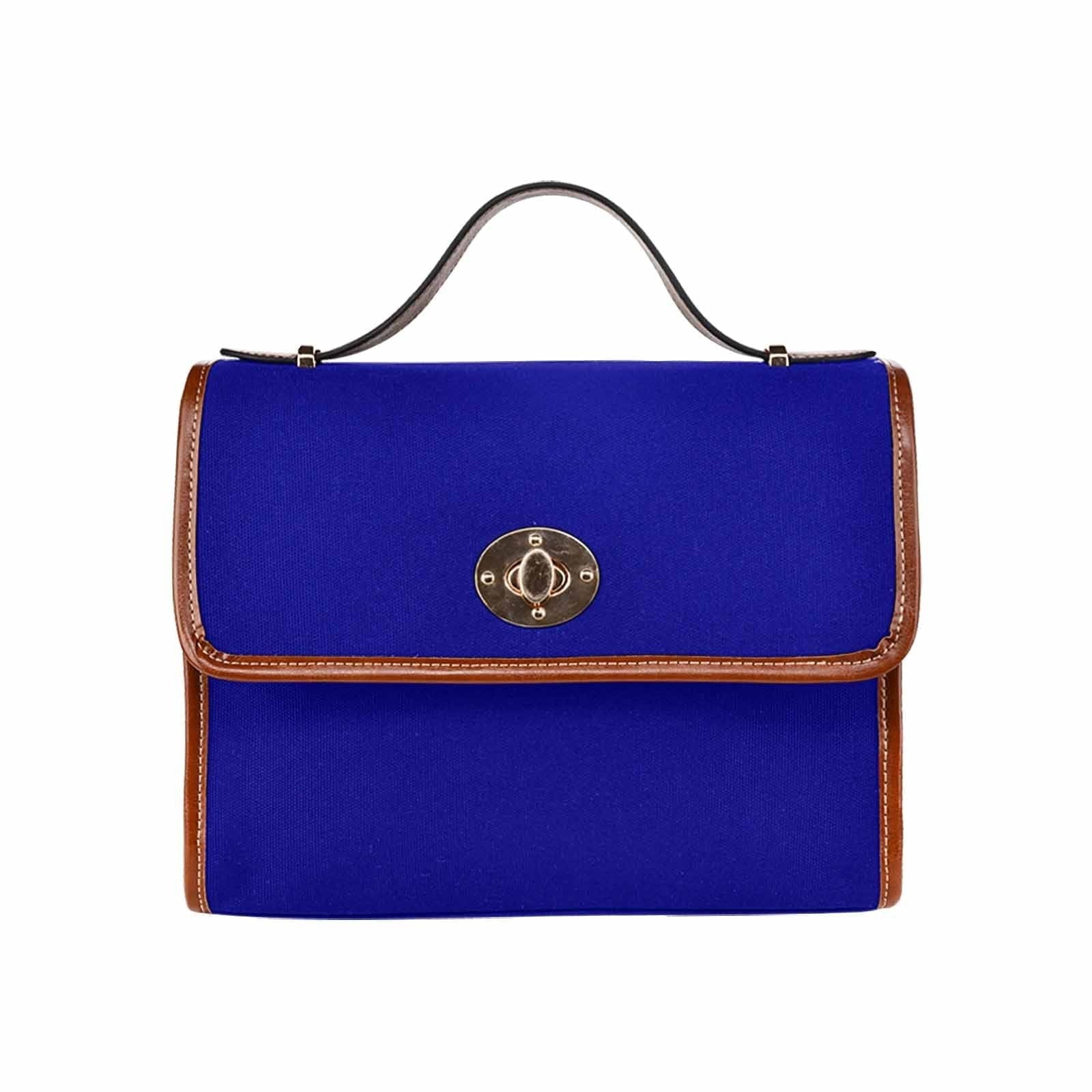 Dark blue waterproof canvas handbag with brown crossbody strap, featuring two interior pockets and a zipper pocket.