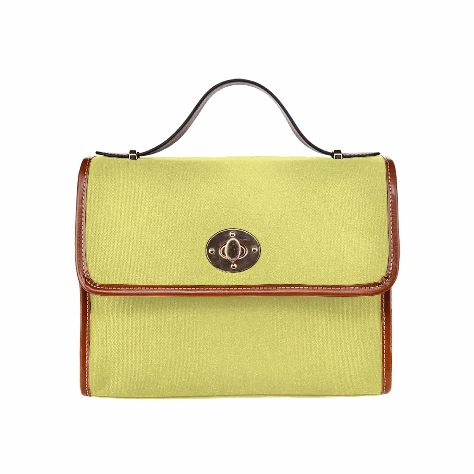 Stylish honeysuckle yellow canvas handbag with brown crossbody strap, featuring two interior pockets and a zipper pocket.