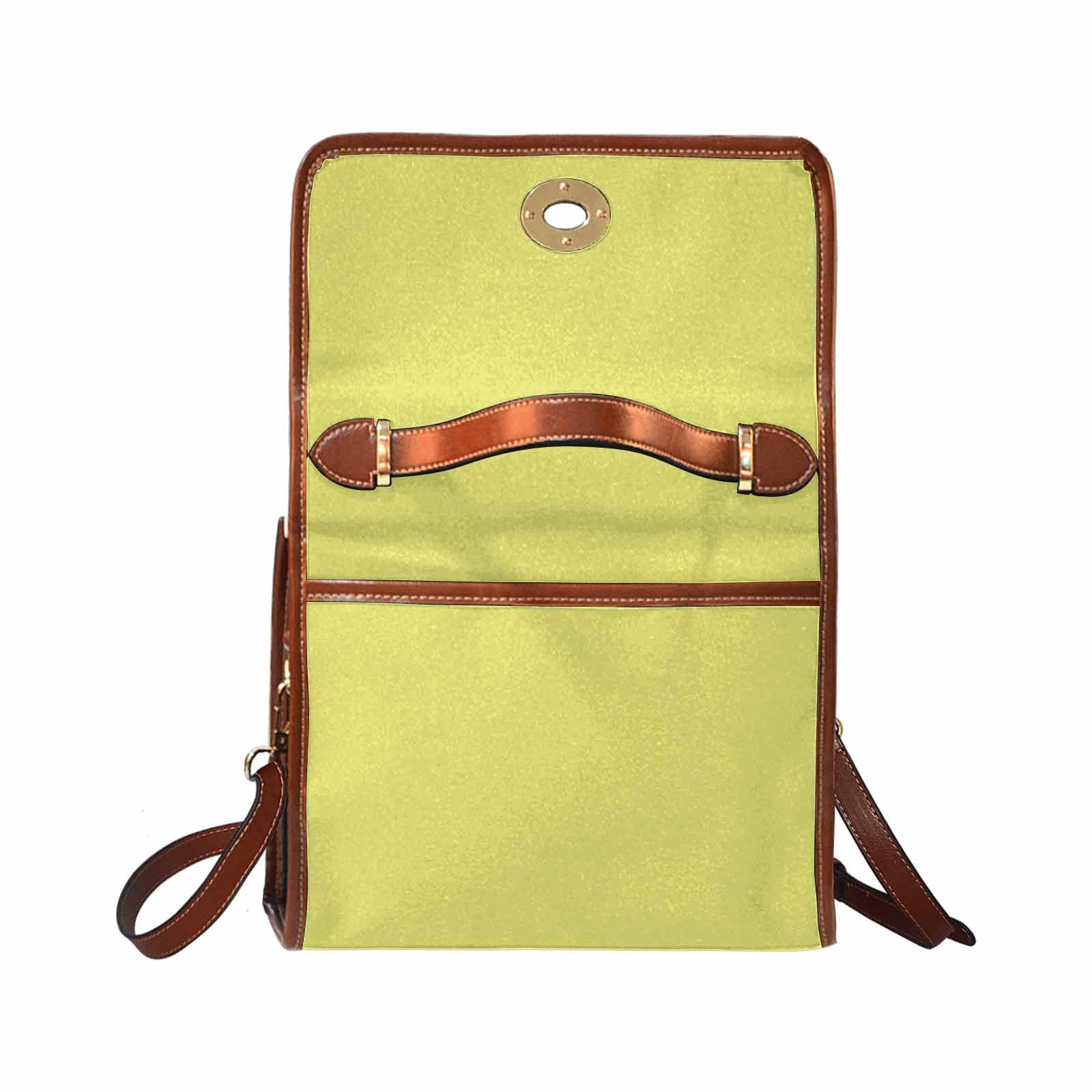 Stylish honeysuckle yellow canvas handbag with brown crossbody strap, featuring two interior pockets and a zipper pocket.