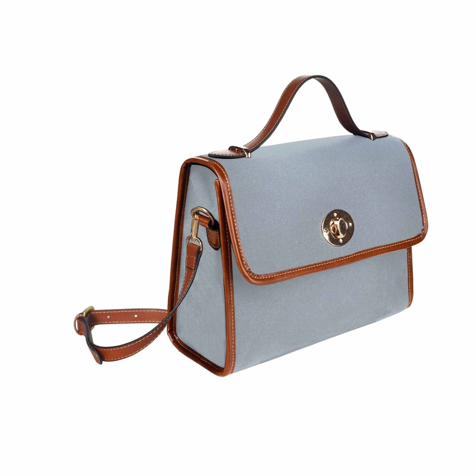 Canvas Handbag in Misty Blue Gray with brown crossbody strap, showcasing its stylish design and durable material.