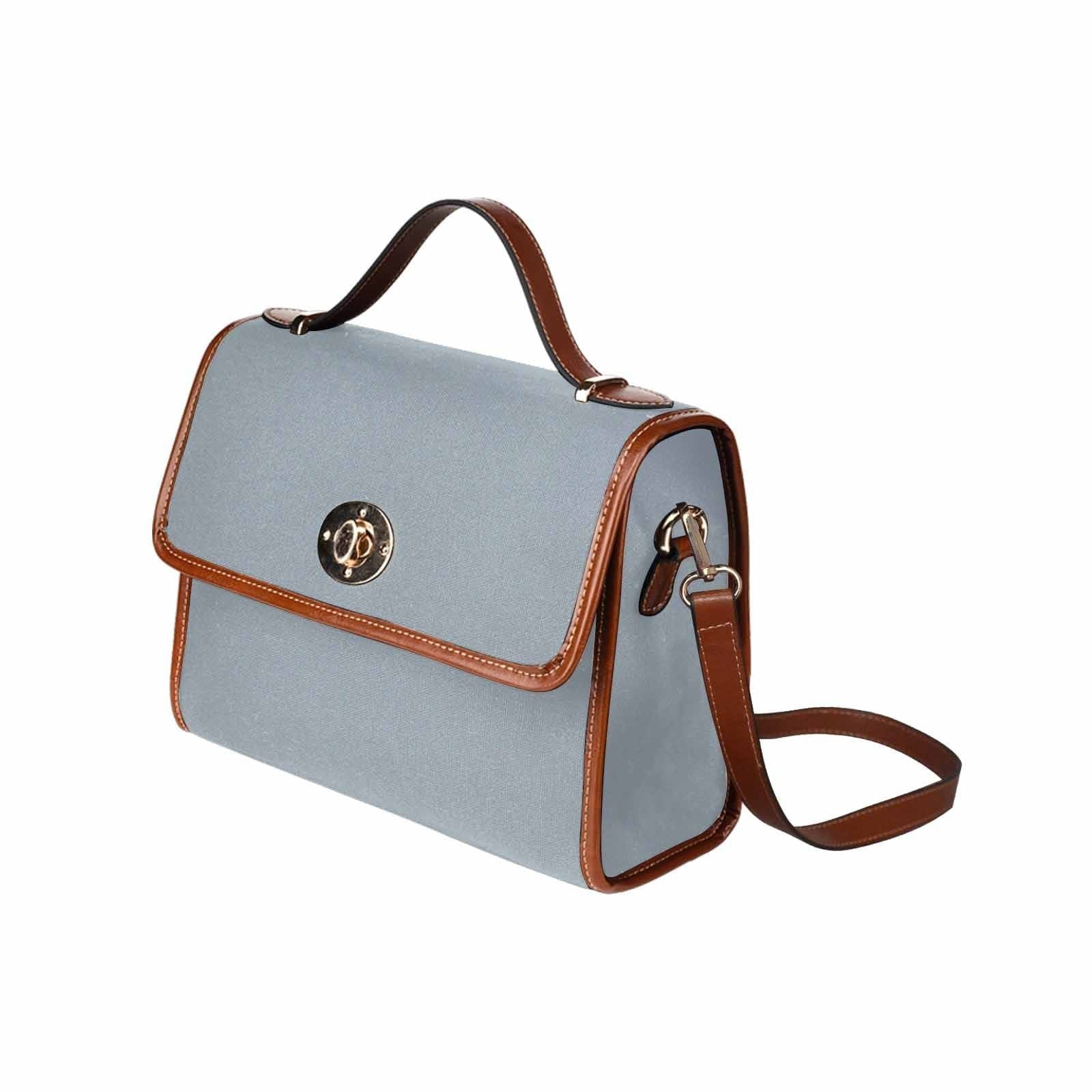 Canvas Handbag in Misty Blue Gray with brown crossbody strap, showcasing its stylish design and durable material.