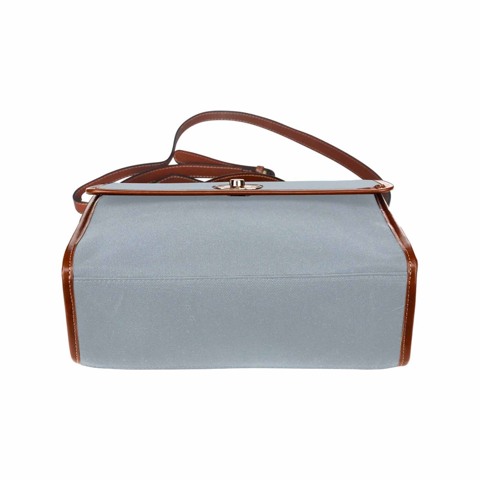 Canvas Handbag in Misty Blue Gray with brown crossbody strap, showcasing its stylish design and durable material.