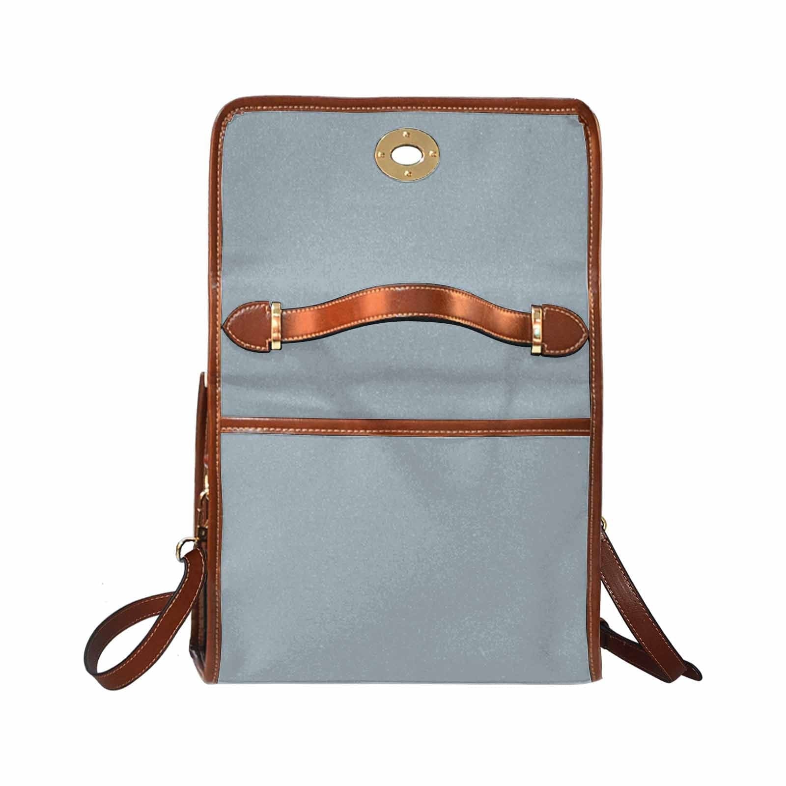 Canvas Handbag in Misty Blue Gray with brown crossbody strap, showcasing its stylish design and durable material.